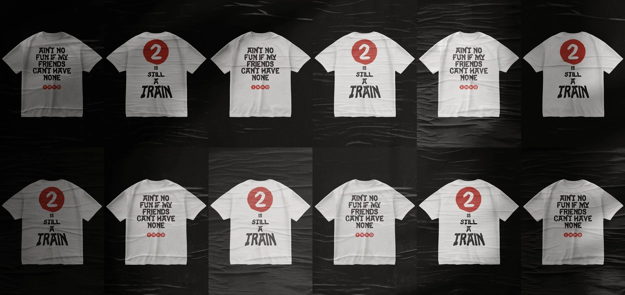 Multiple white T-shirts with black and red text, displayed against a dark background. The shirts have the phrase "AIN'T NO FUN IF MY FRIENDS CAN'T HAVE NONE" with a red number "2" and the statement "IS STILL A TRAIN" on some shirts.