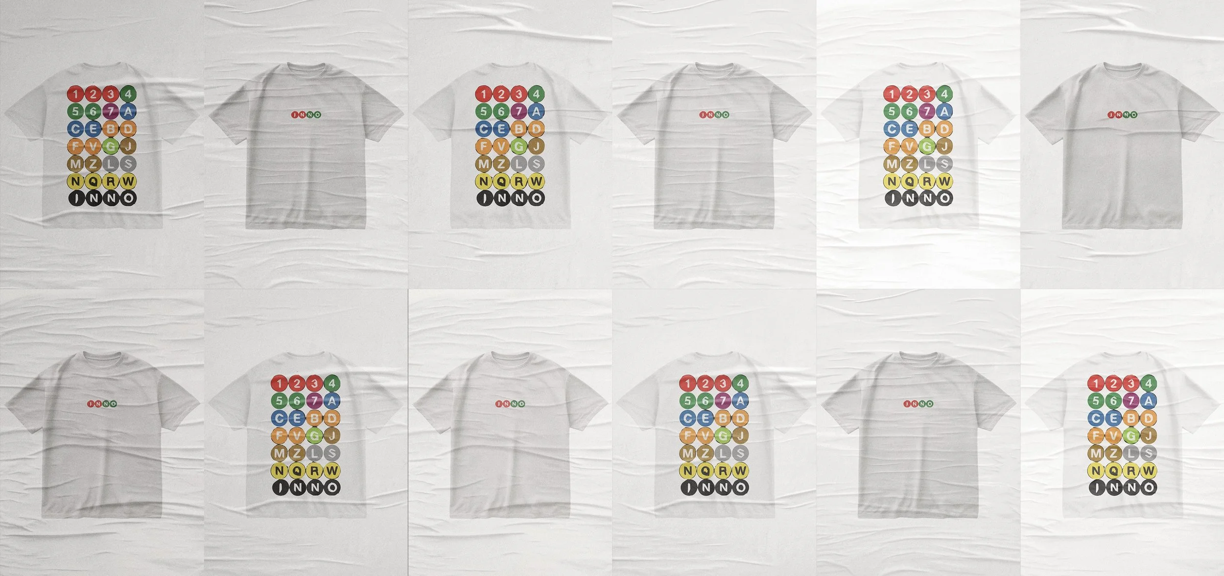 Multiple white T-shirts displayed on a crinkled white surface, some with colorful subway map designs and some with the text 'ON NO' in red and green.
