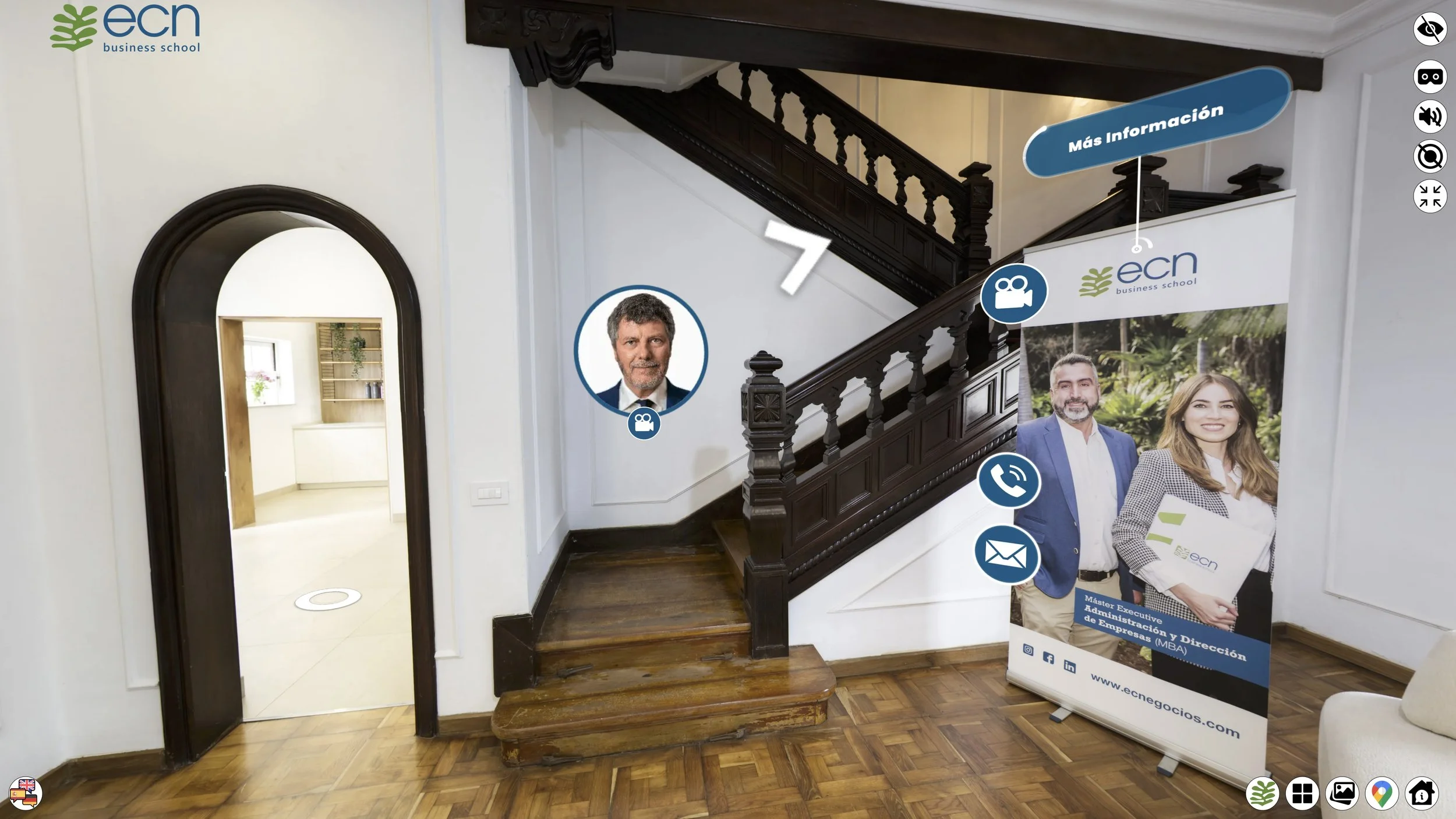 Indoor staircase with promotional banner for ECN Business School featuring images of two professionals and contact icons.