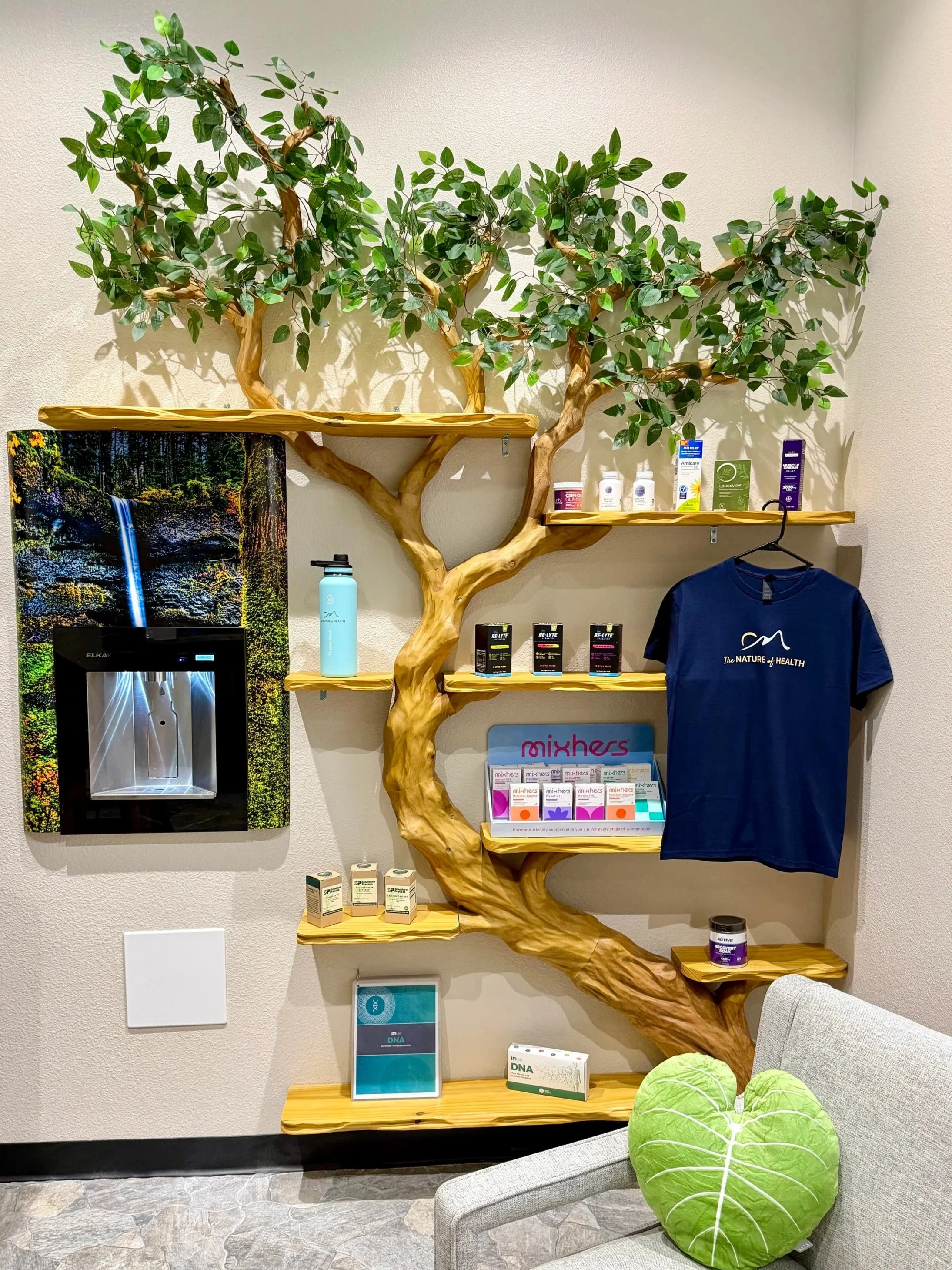 Nature-inspired retail display and greenery at The Nature of Health in Gilbert, AZ