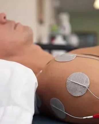Neubie direct current electrical stimulation therapy applied to the shoulder at The Nature of Health in Gilbert, AZ