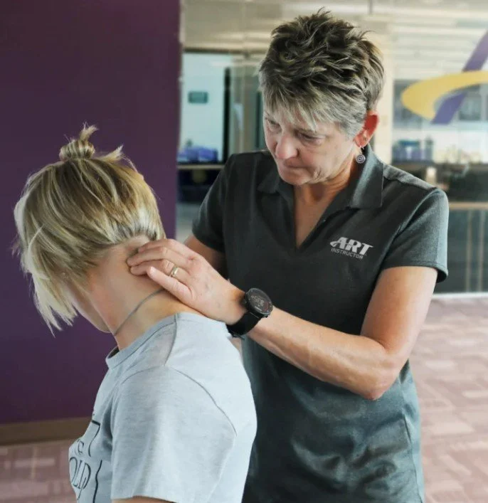 Active Release Technique (ART) therapy applied to neck and shoulder muscles at The Nature of Health in Gilbert, AZ