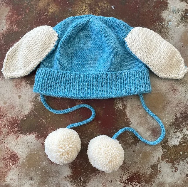 An artifact from the Yo Soy Conejo project: the blue bunny-eared hat worn by Liam Ramos, symbolizing the biopolitics of the artifact and the semiotics of vulnerability in PLCFA.