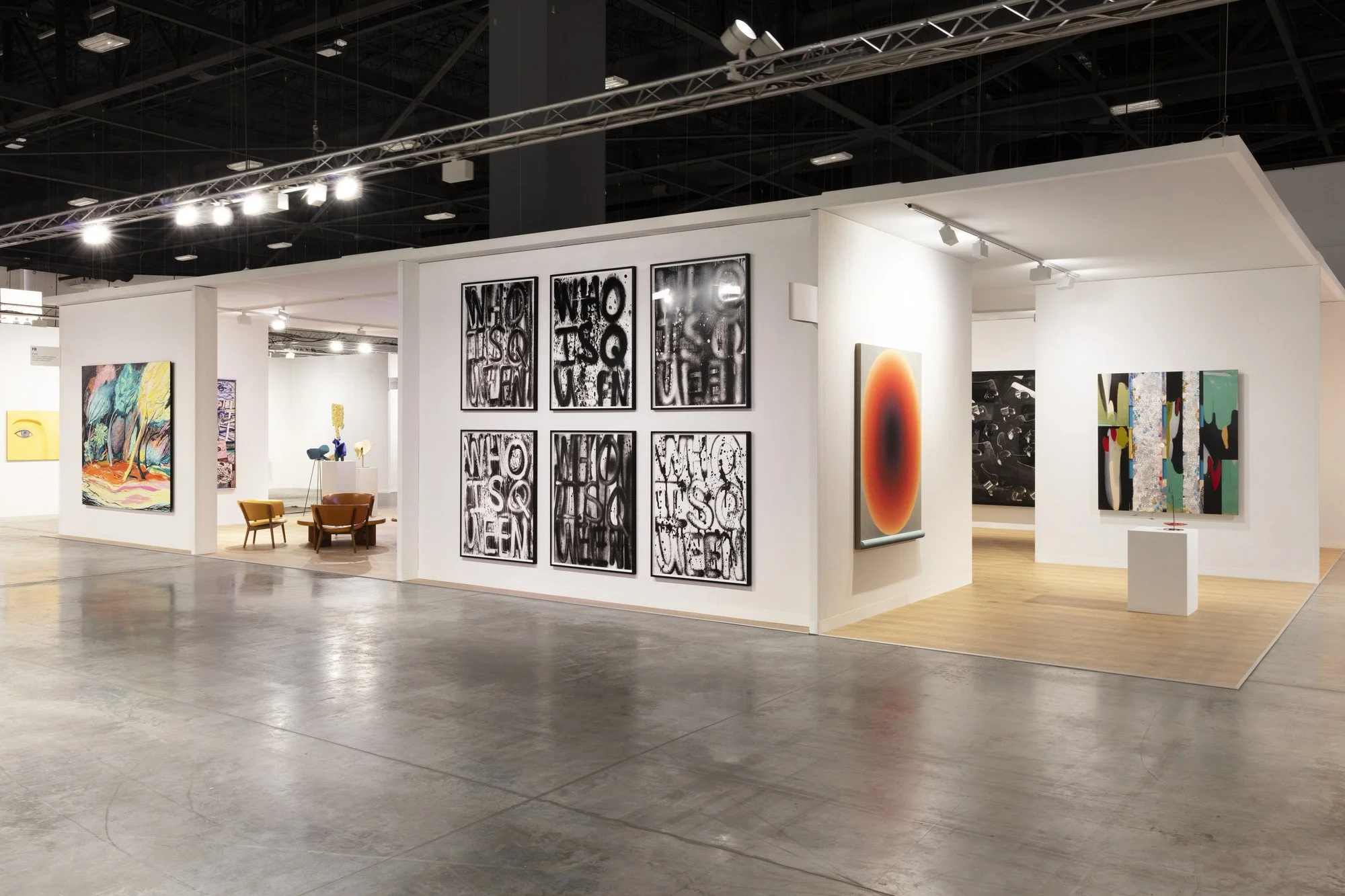 The expansive white architectural booth layout of Pace Gallery at Art Basel Miami Beach 2021, displaying contemporary paintings, text art installations, and minimalist visitor lounge spaces.