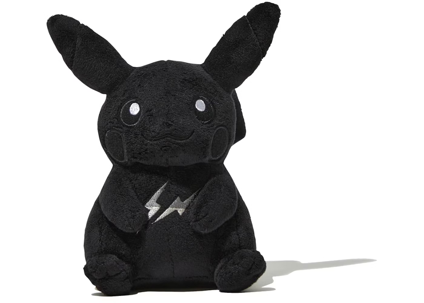 A monochrome black plush doll of Pikachu, featuring the silver Fragment Design double lightning bolt logo embroidered on its chest as part of the Thunderbolt Project.