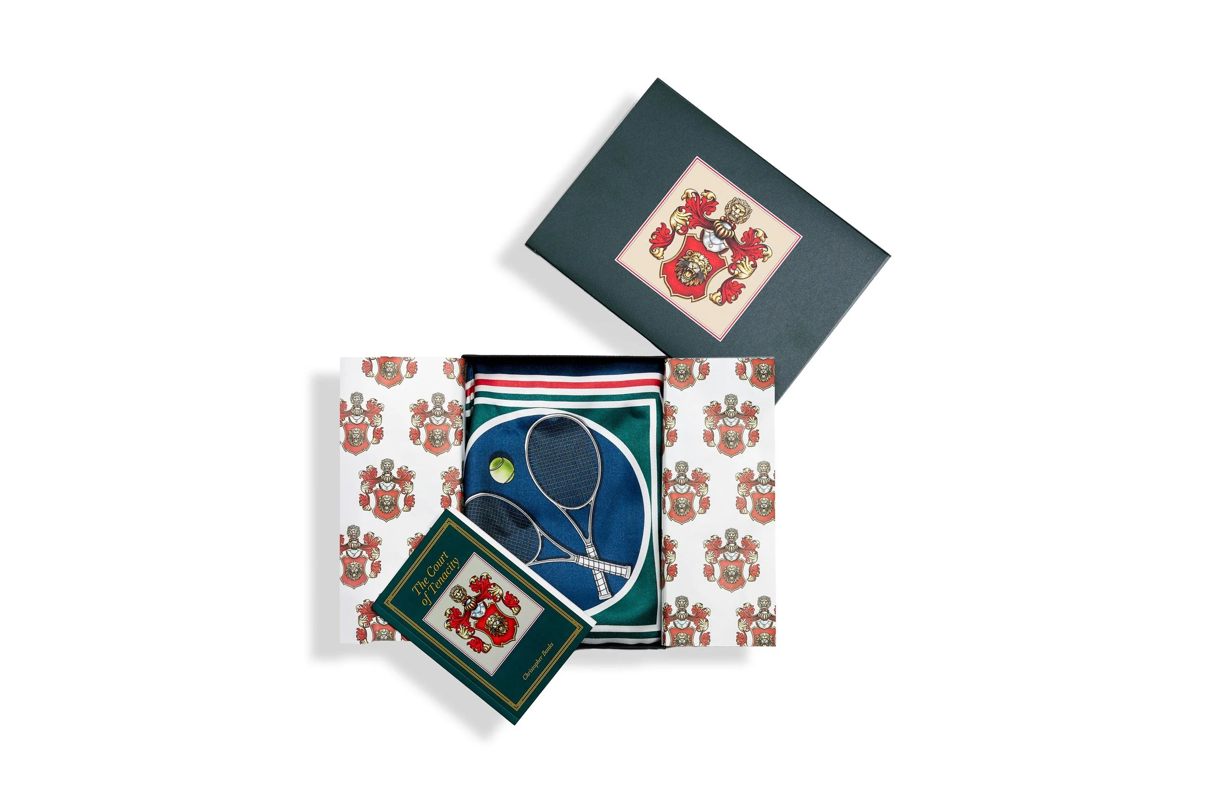 A curated arrangement of the physical silk scarf, the hardbound product book, and the digital provenance certificate, illustrating Triple-Link Validation.