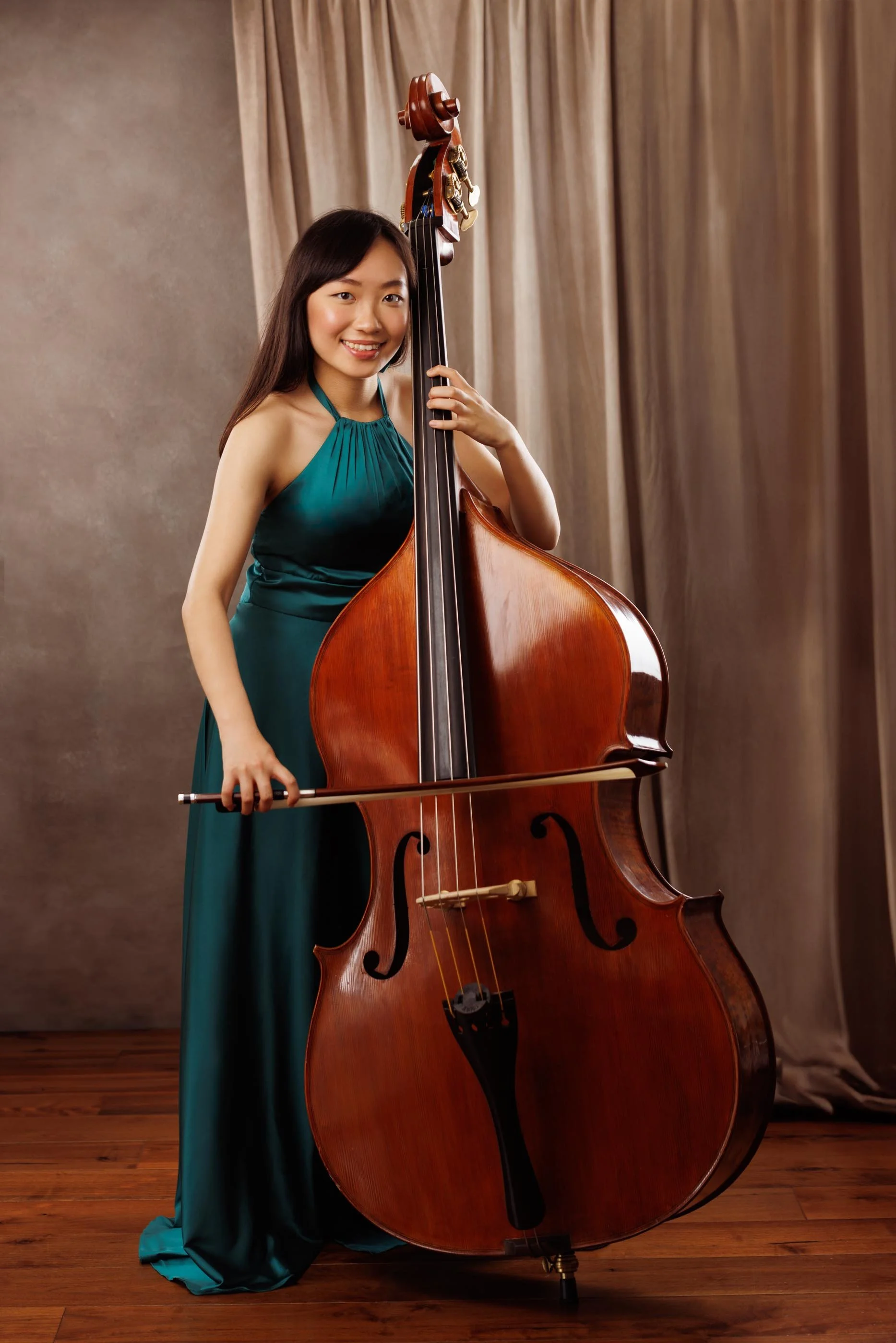 Full-length studio portrait of a young woman double bass musician in a teal dress — Edinburgh portrait photographer, Angelique Portrait Photography East Lothian