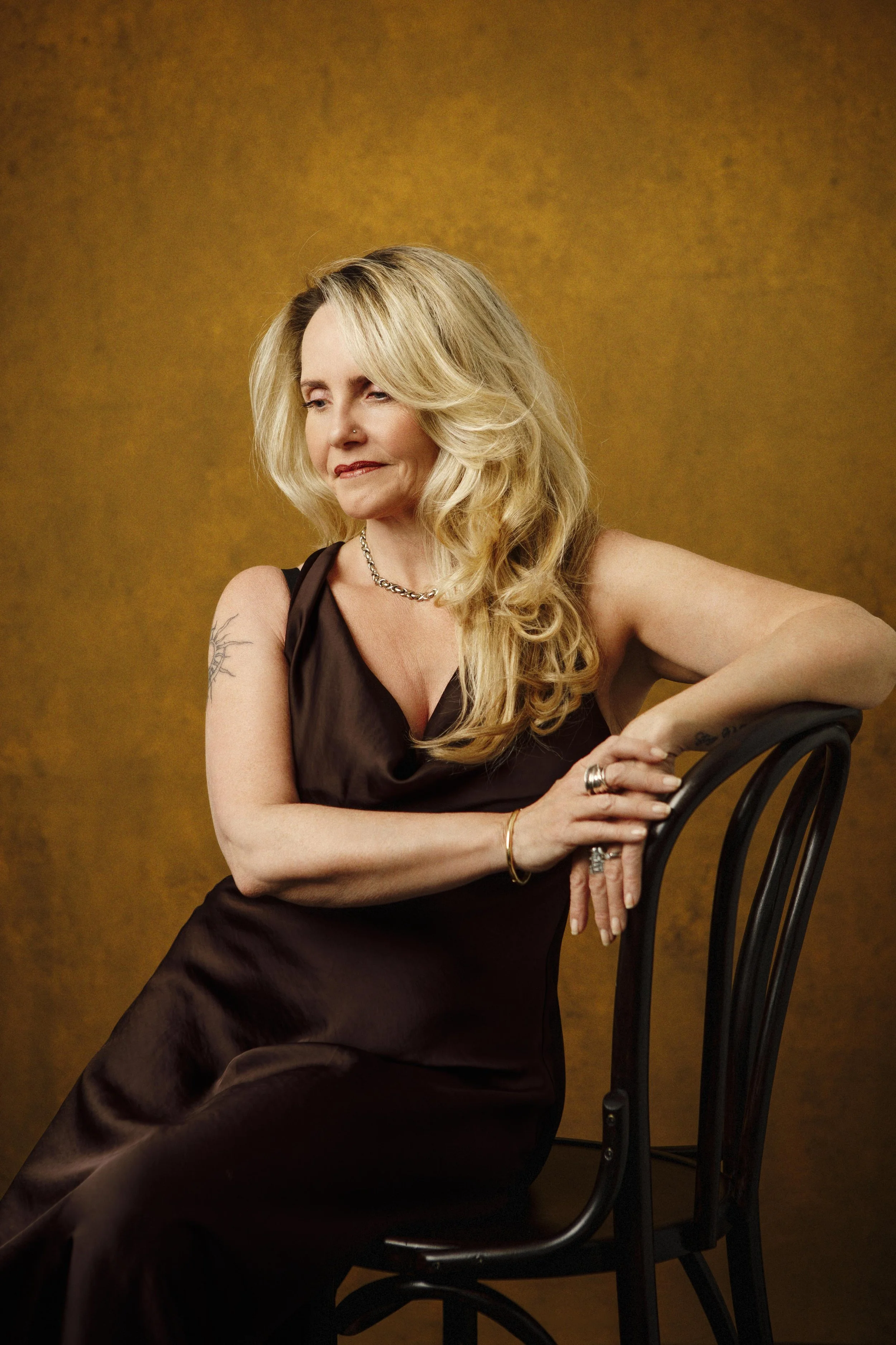 Studio portrait of Vickie wearing a chocolate silk dress, photographed for SEEN at Angelique Portrait Photography in East Lothian.