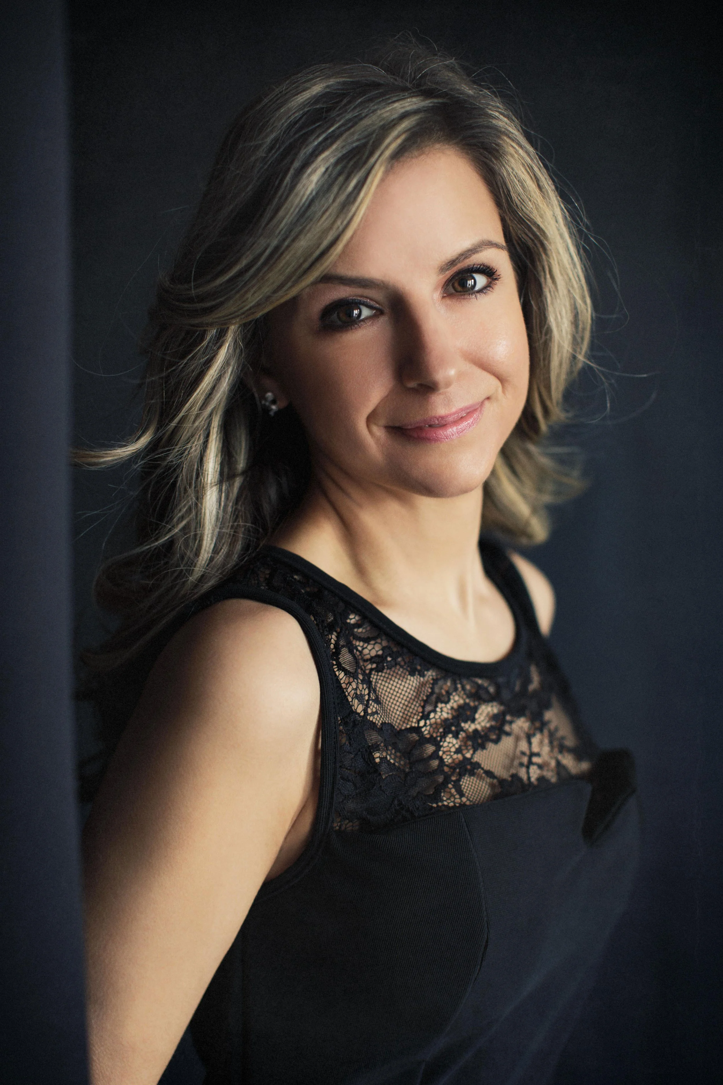 woman looking sideways to camera posing for her portrait.