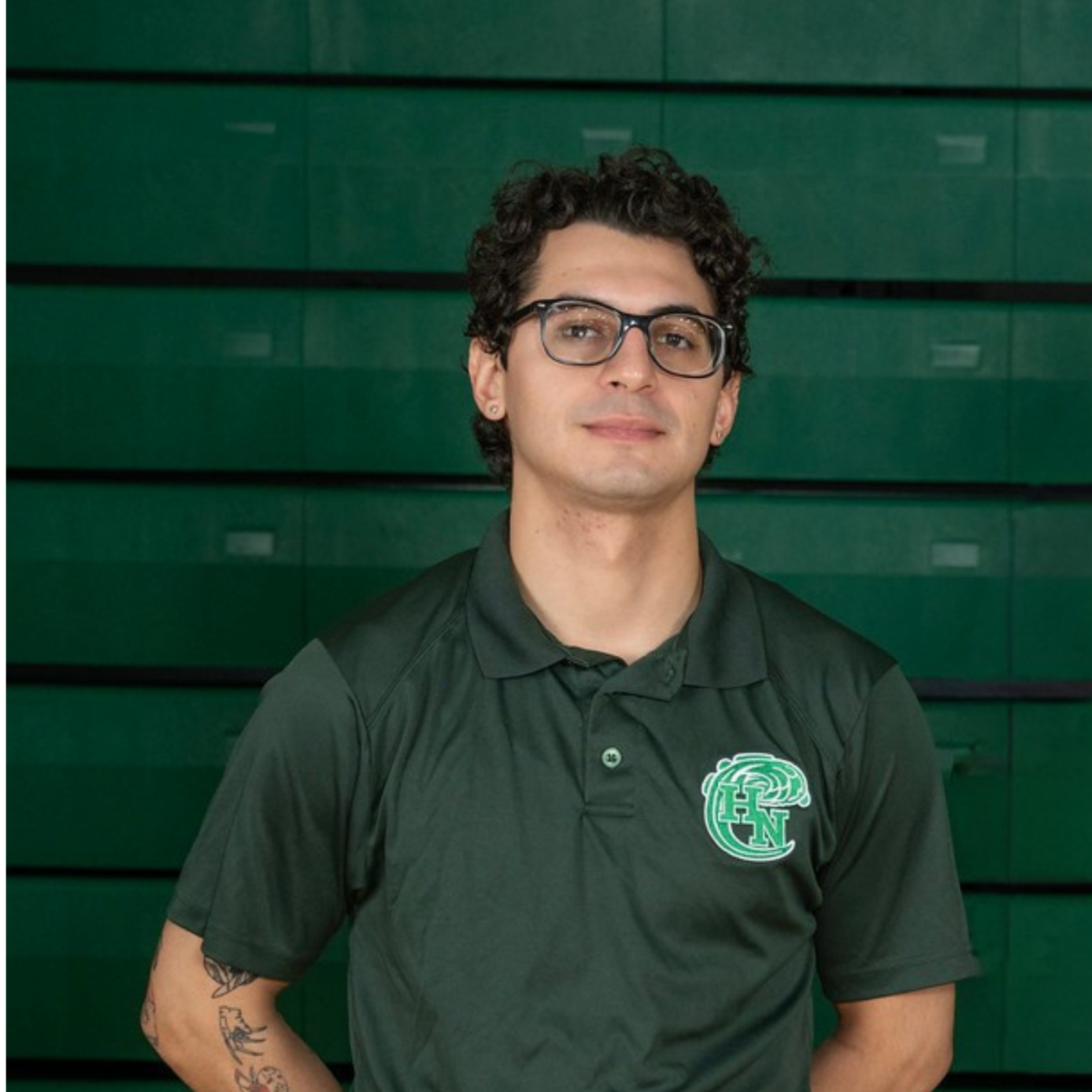 A logo with a stylized green wave and the large green letters 'H' and 'N' on a black background.