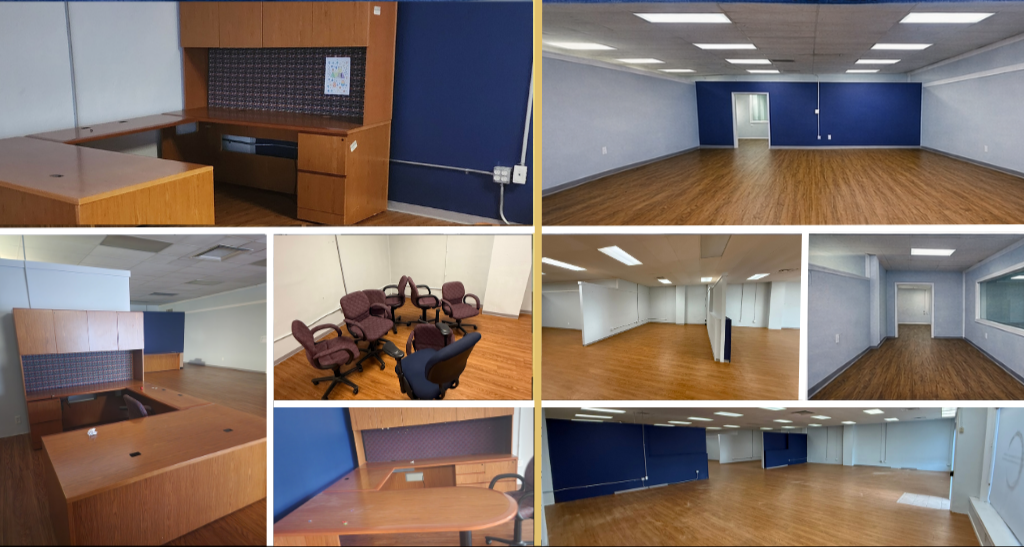 Office space and conference room with wooden floors, blue and white walls, desks, chairs, and large open areas.