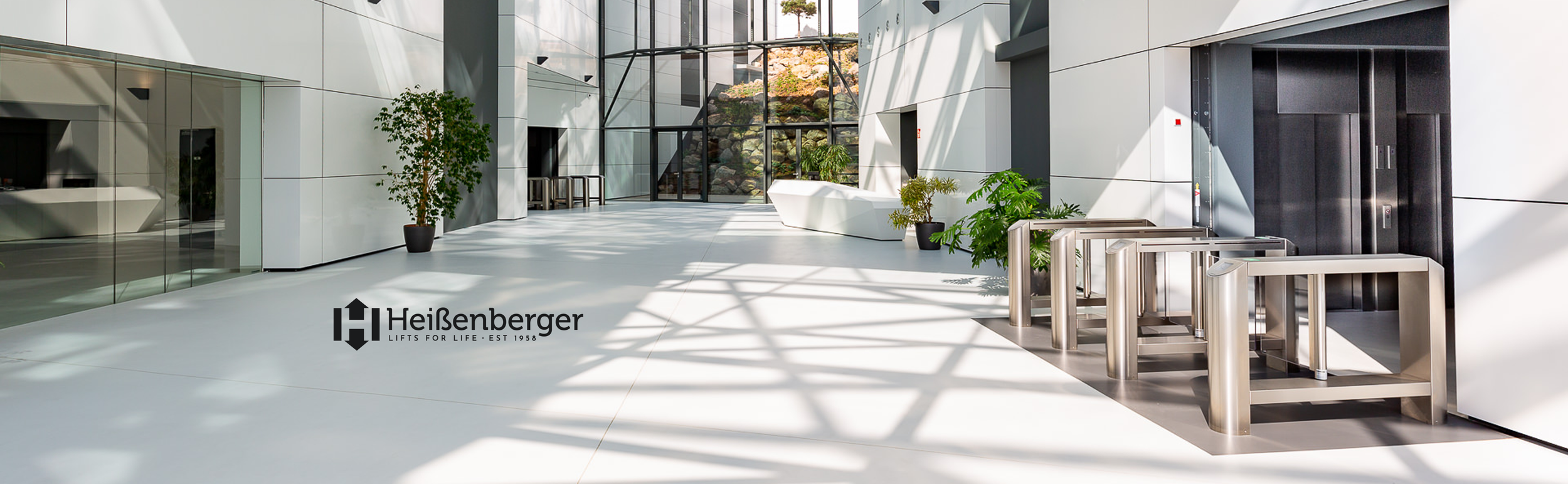 Stylized image of people moving through a modern building with the Heißenberger logo, symbolizing the elevator company’s partnership and growth aspirations.