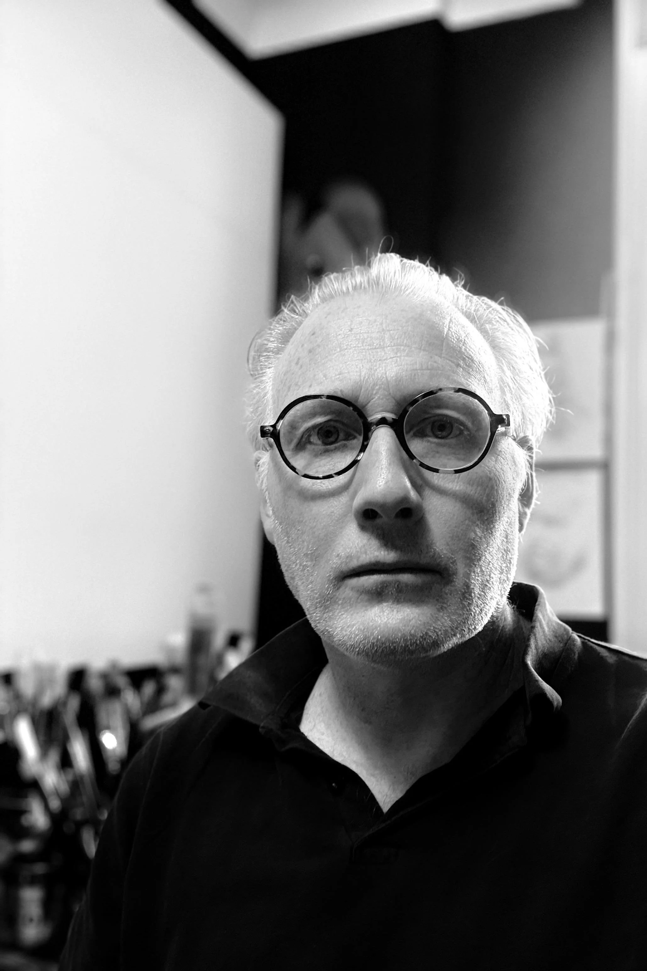 A close-up black and white self-portrait of a Simon.