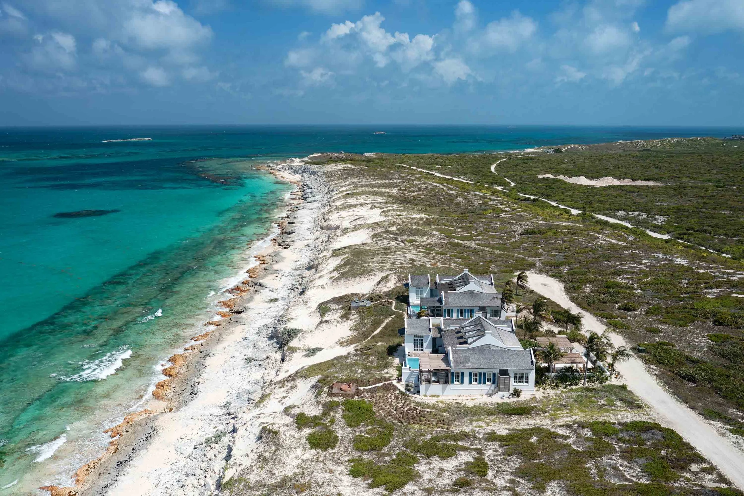 09-ambergris-cay-aurora-villa-aerial-3000px.jpeg