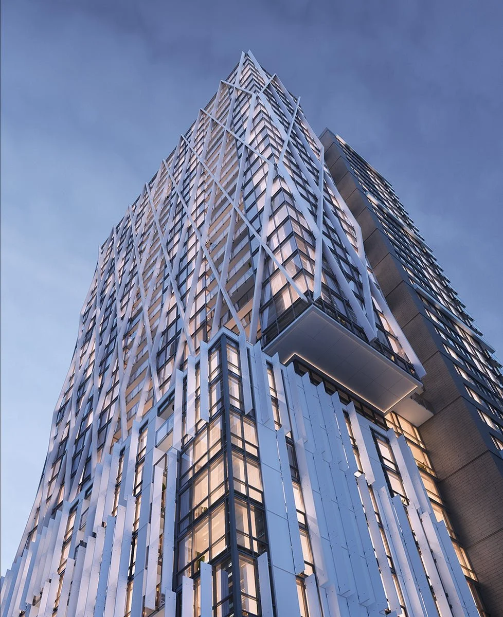 ramatic upward view of the building at dusk, highlighting vertical form and lighting