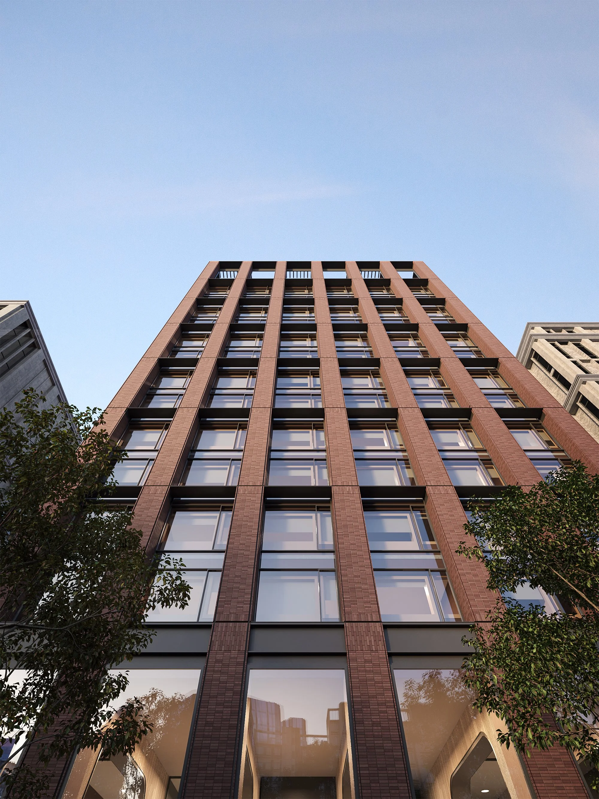 Street-level view of Ace Hotel entrance with modern brickwork and large glass panels