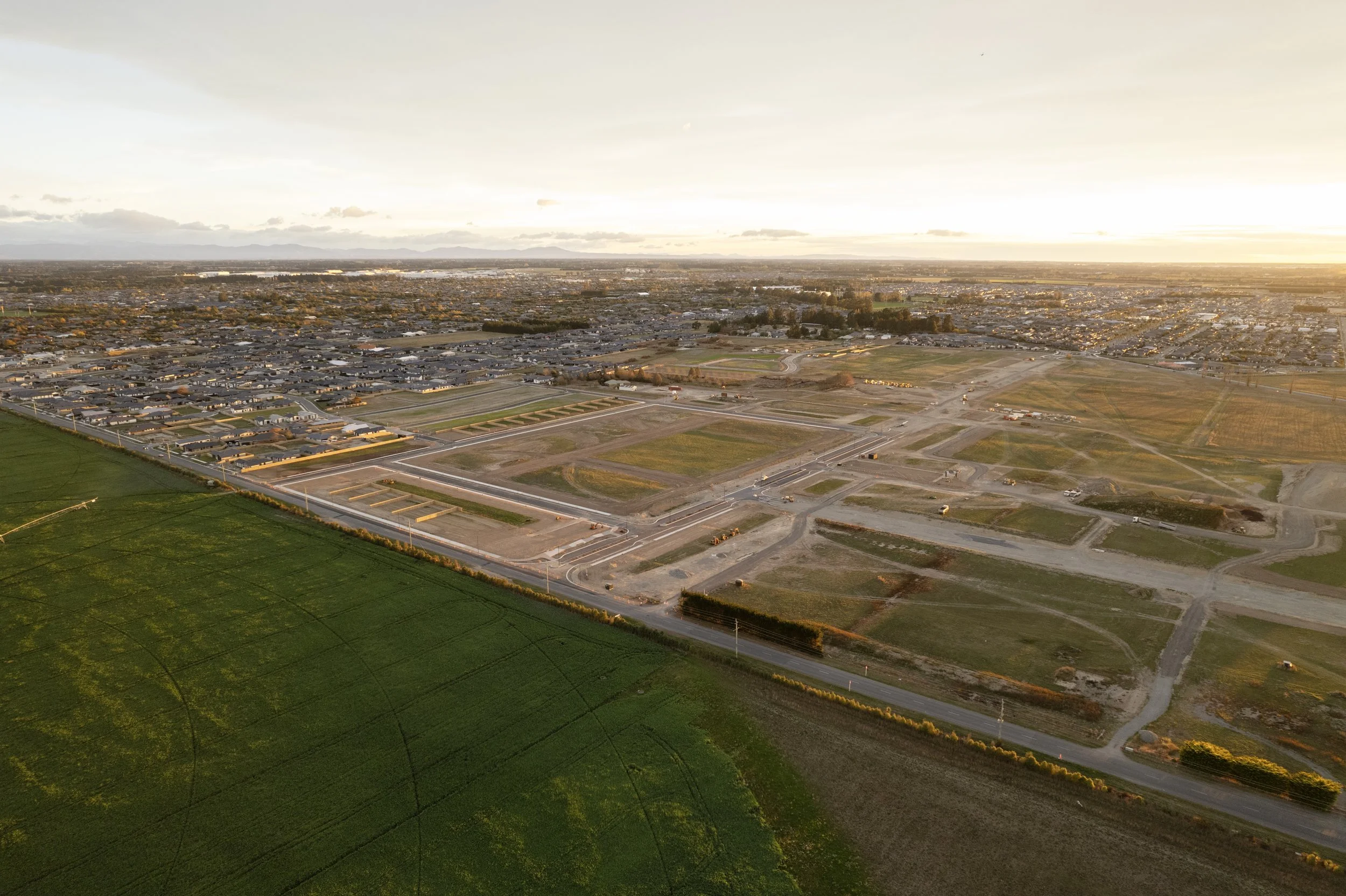 Unbuilt aerial perspective of Arbor Green with marked lots and minimal landscaping