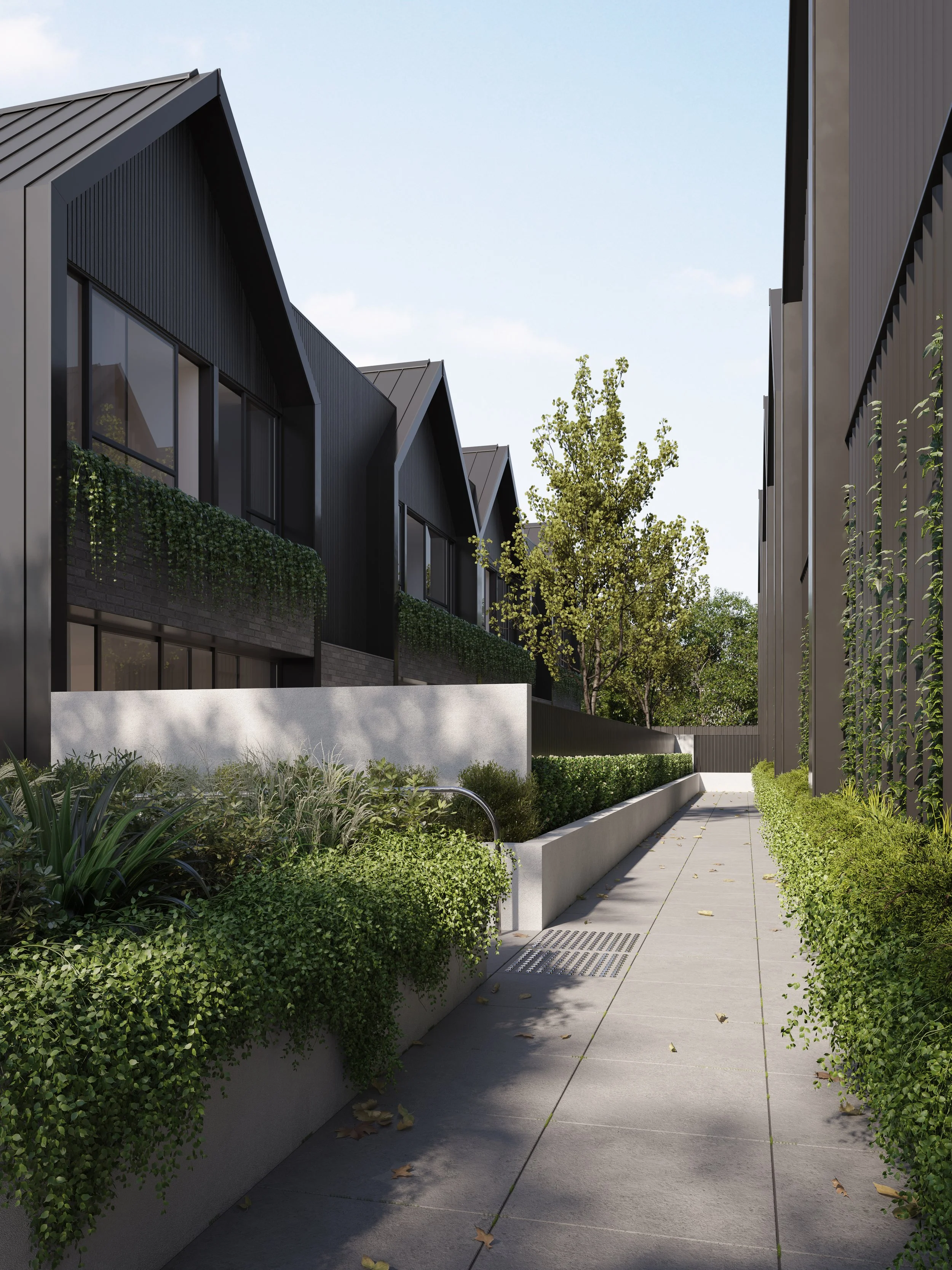 Landscaped garden area with community seating and shared green space in Avenue House development