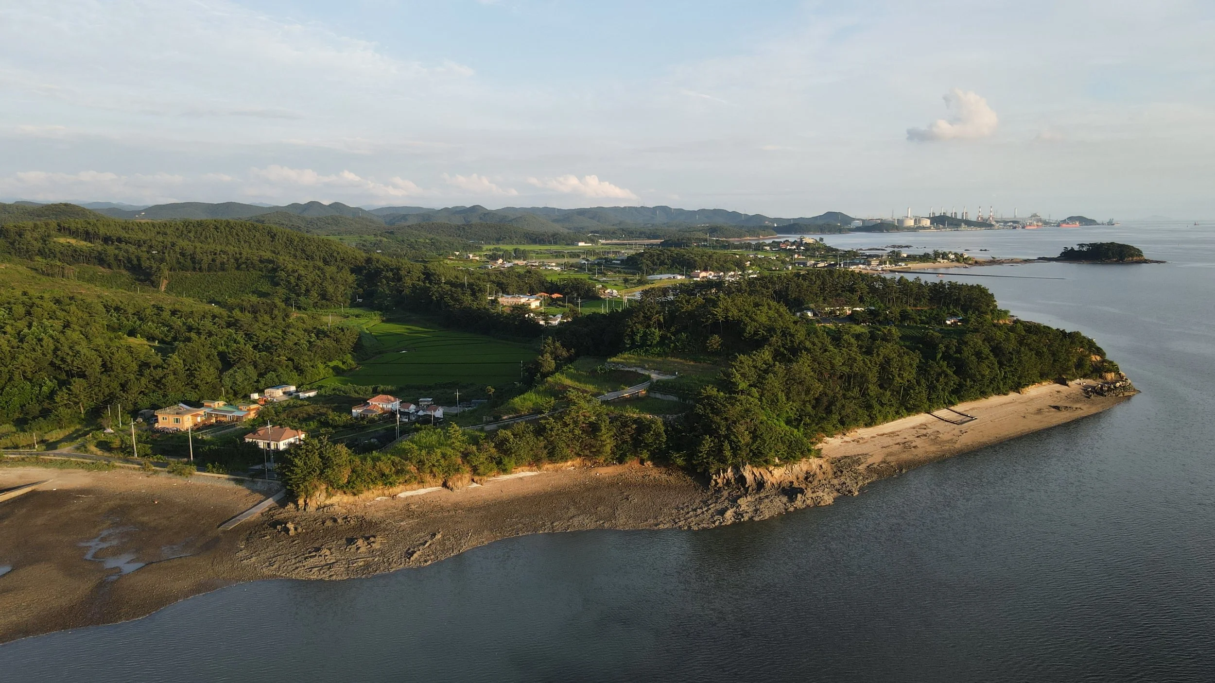 Raw aerial photo of undeveloped site before construction and landscaping