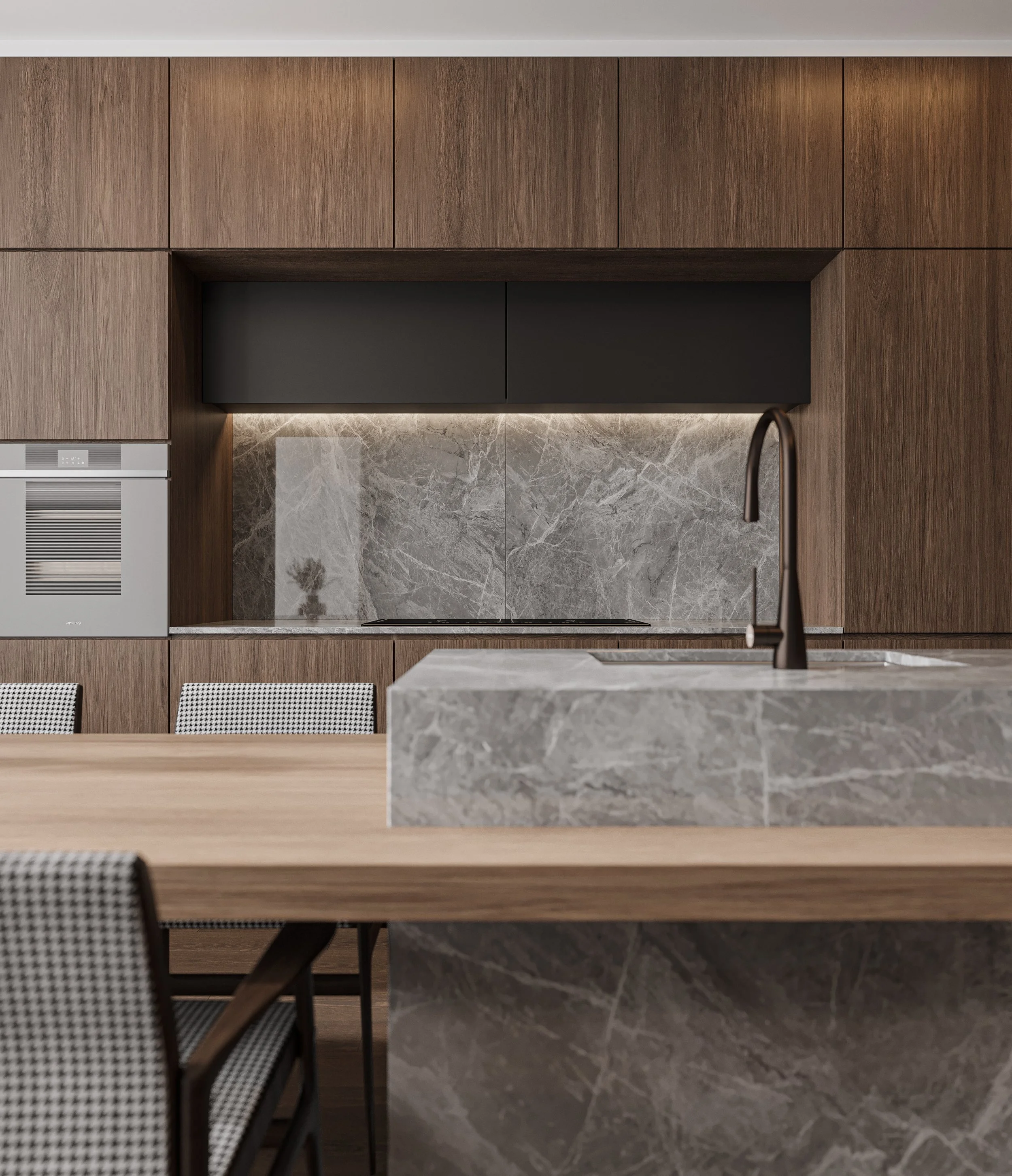 Close-up of kitchen island showing stone surface, seating, and clean finishes