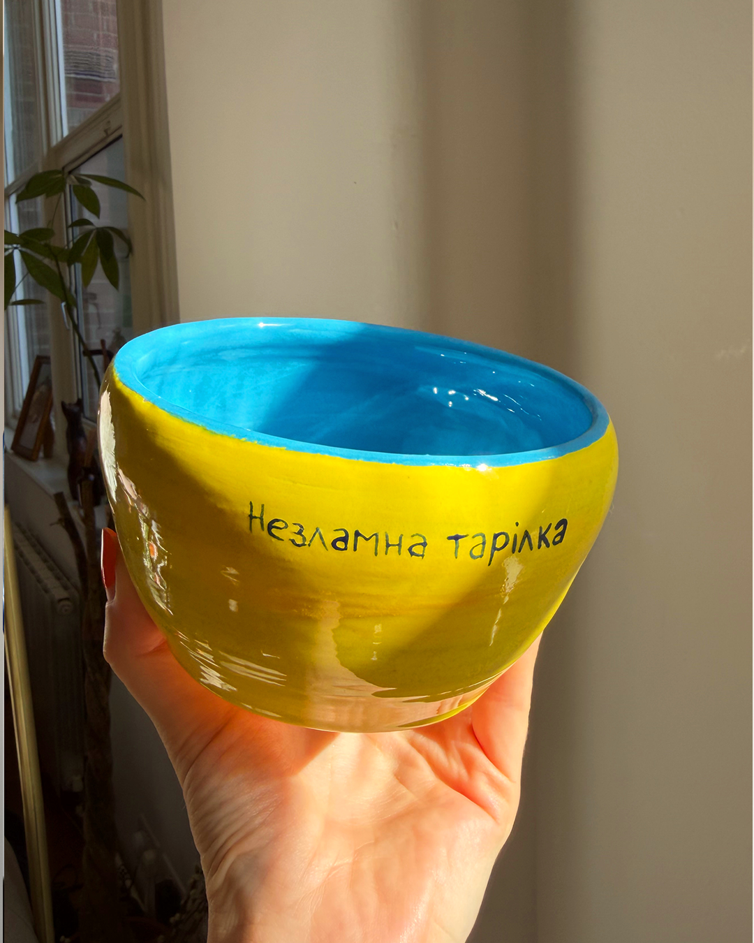 A bowl made by a blind Ukrainian veteran in yellow