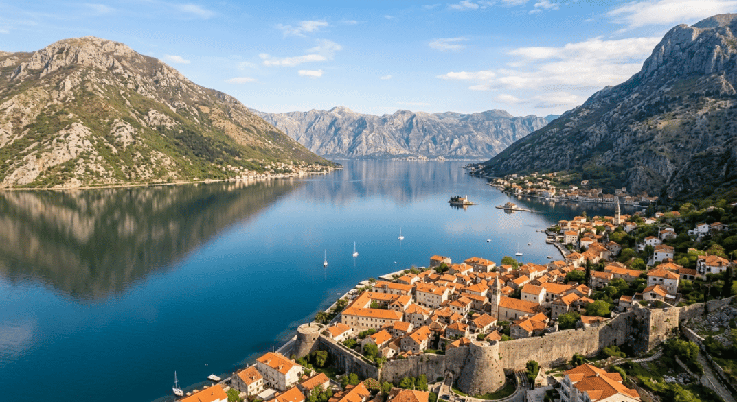 The medieval lanes and dramatic Adriatic scenery of Kotor Bay, looking towards the smaller bay towns like Perast under the soft light of late spring.