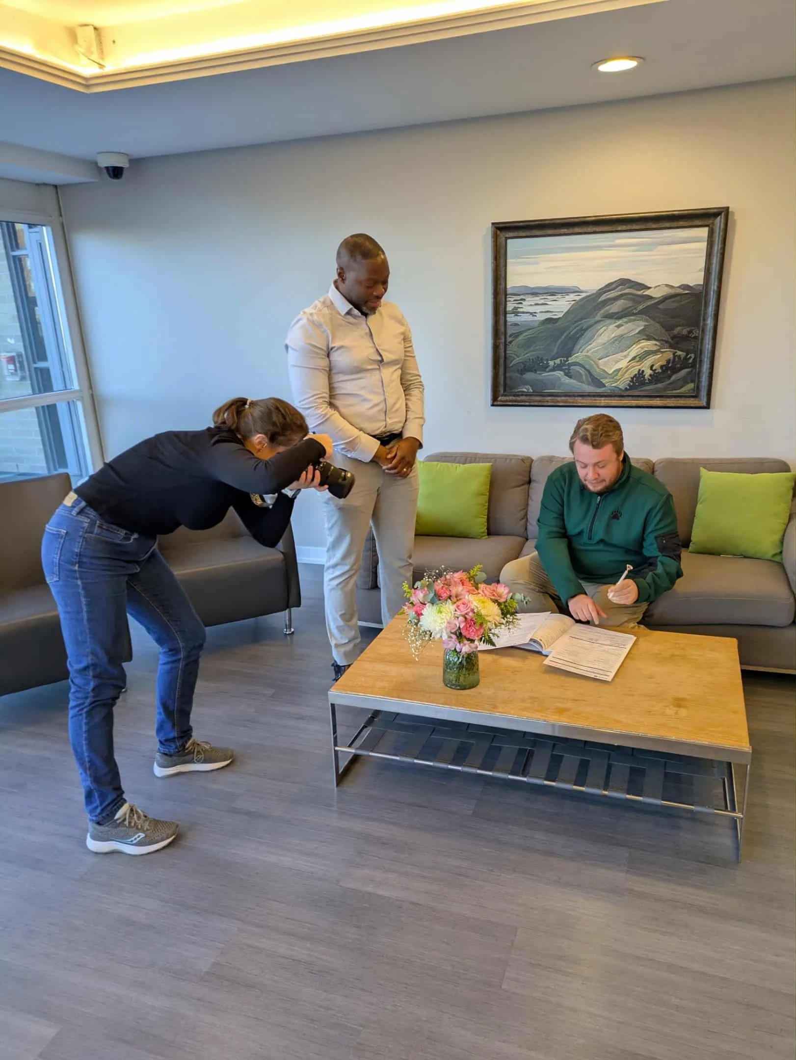 Photographer capturing a marriage license signing