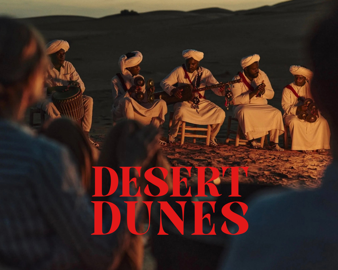 An event in the Morrocan desert with the words desert dunes overlaid