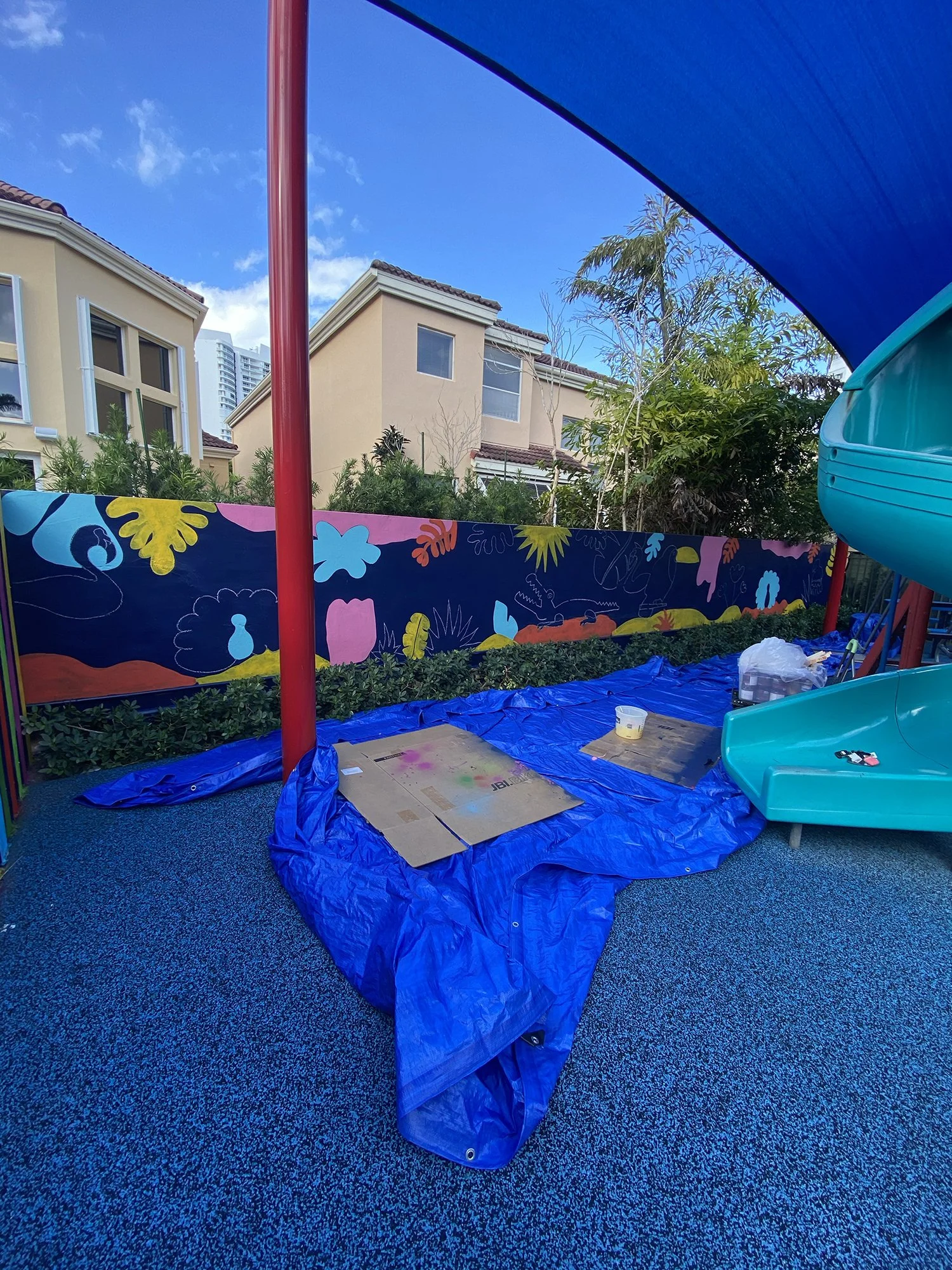 Day 4 progress Shot: Community Playground Mural in Island Way Aventura, FL. Day 1 Progress Shot (40' L x 5' H not including the fence area) 5 days to complete. Spray paint & House paint, Free Hand.