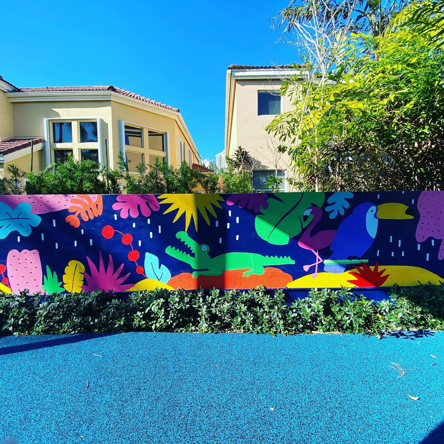 Completed: Community Playground Mural in Island Way Aventura, FL. Day 1 Progress Shot (40' L x 5' H not including the fence area) 5 days to complete. Spray paint & House paint, Free Hand.