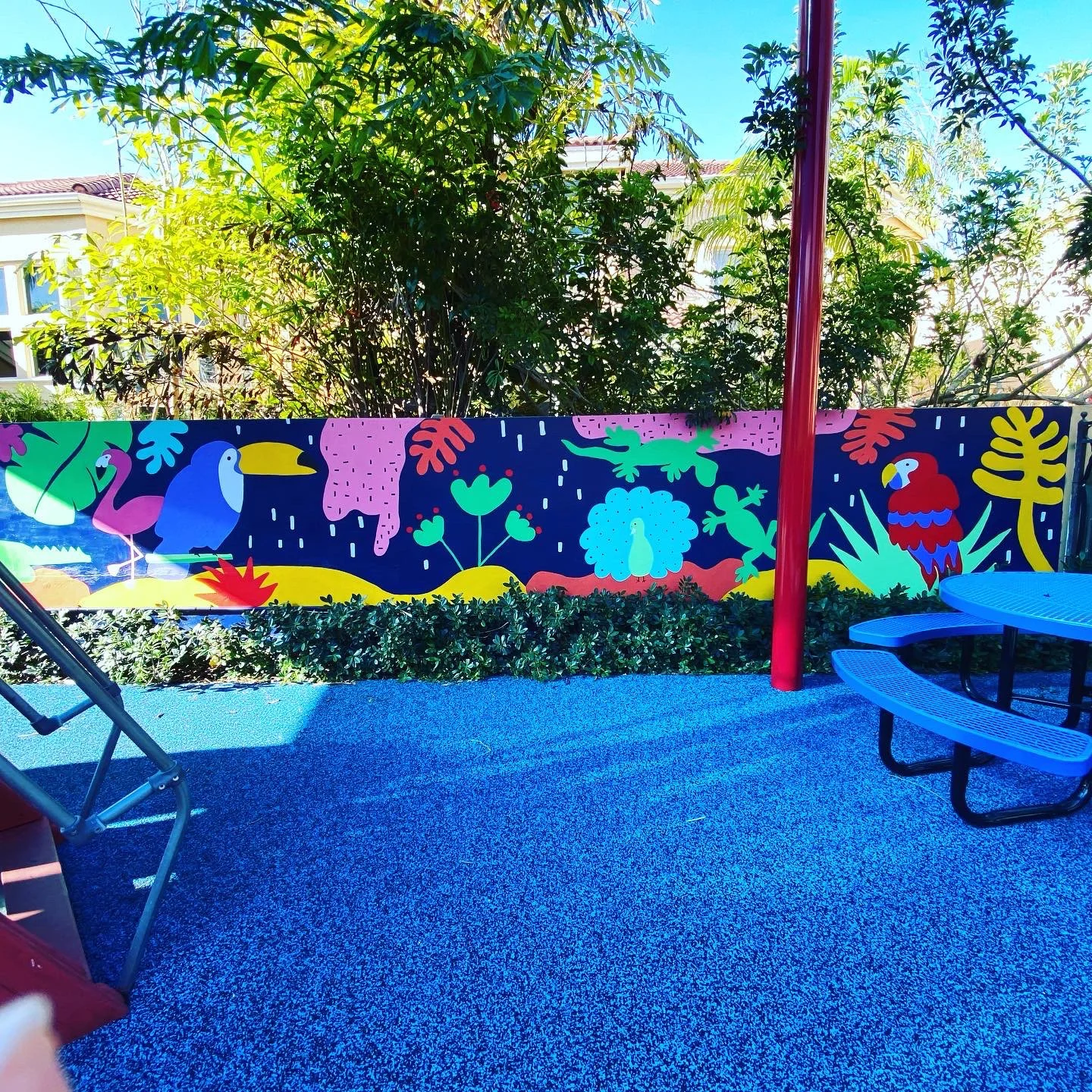 Completed: Community Playground Mural in Island Way Aventura, FL. Day 1 Progress Shot (40' L x 5' H not including the fence area) 5 days to complete. Spray paint & House paint, Free Hand.