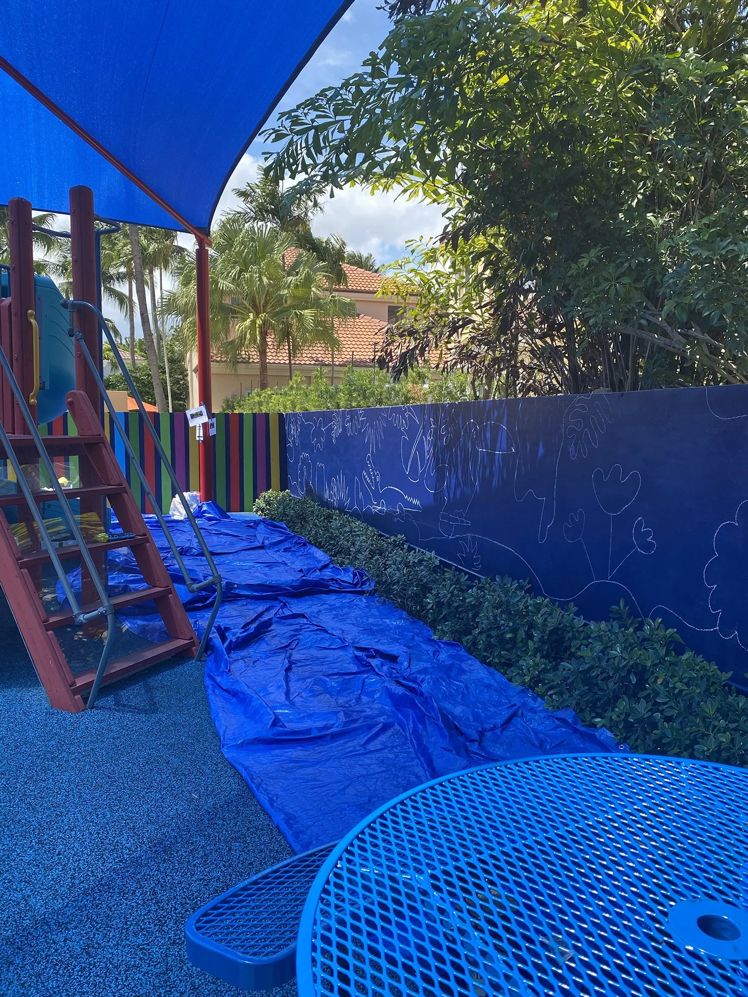 Day 3 progress Shot: Community Playground Mural in Island Way Aventura, FL. Day 1 Progress Shot (40' L x 5' H not including the fence area) 5 days to complete. Spray paint & House paint, Free Hand.