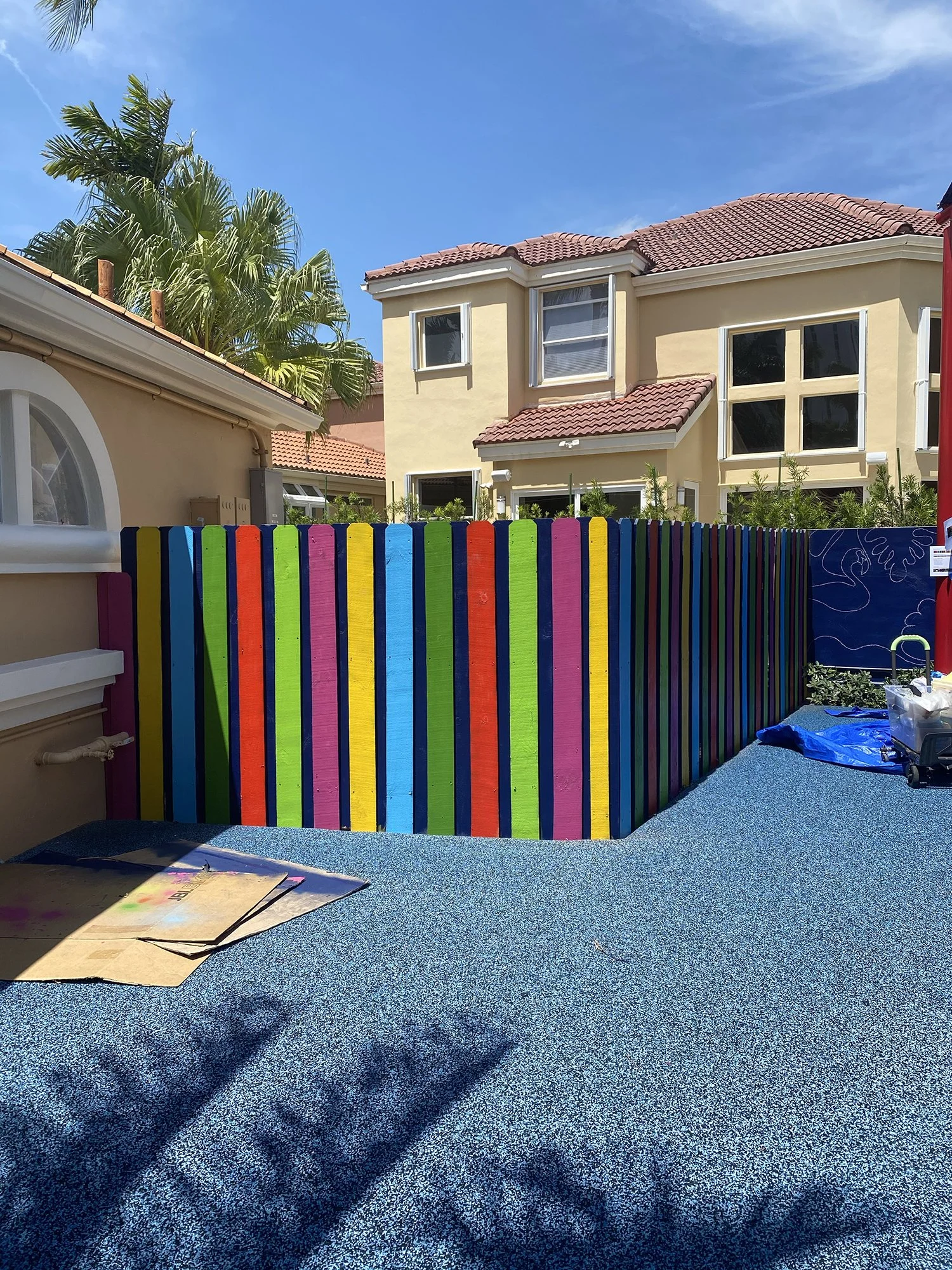 Day 2 progress Shot: Community Playground Mural in Island Way Aventura, FL. Day 1 Progress Shot (40' L x 5' H not including the fence area) 5 days to complete. Spray paint & House paint, Free Hand.