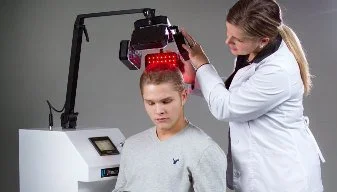 Guy undergoing laser hair treatment