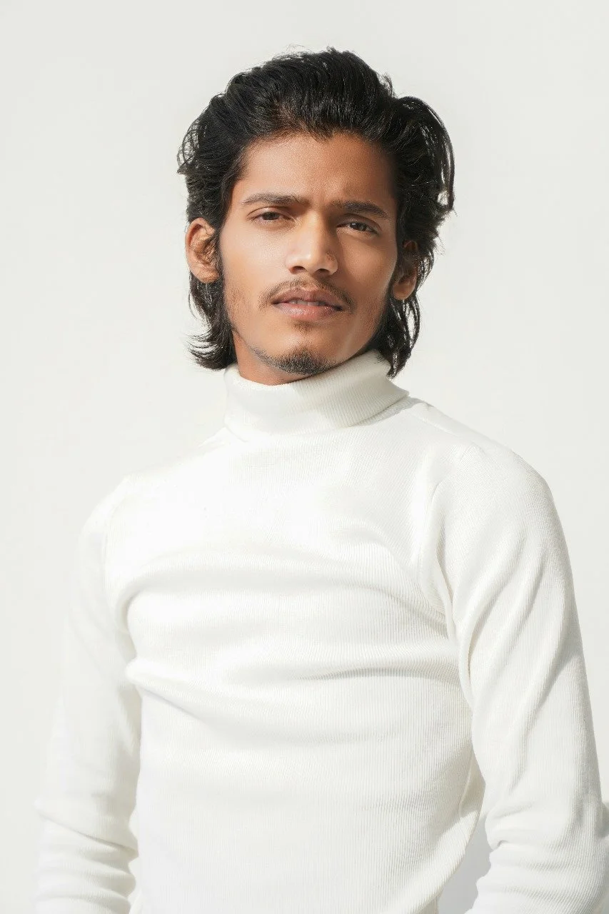 Man with full swept back hair