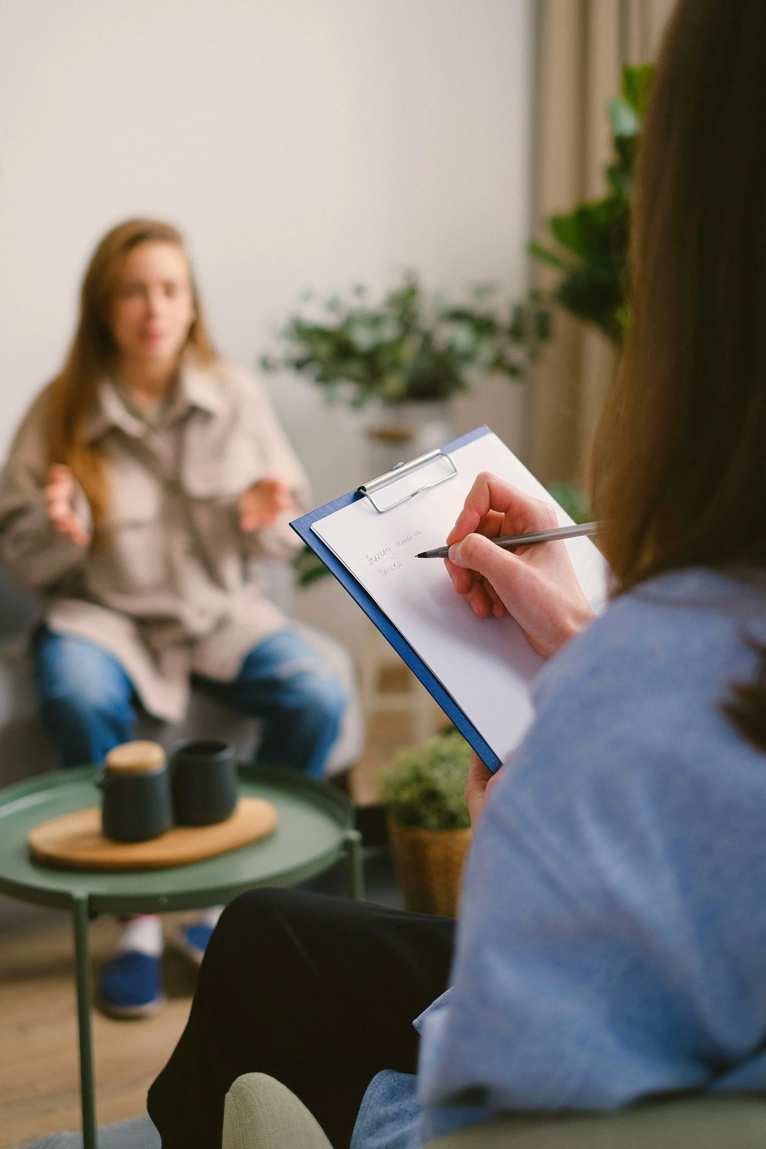An adult completing a neurodiversity-affirming assessment with a psychologist in Redding, CA.