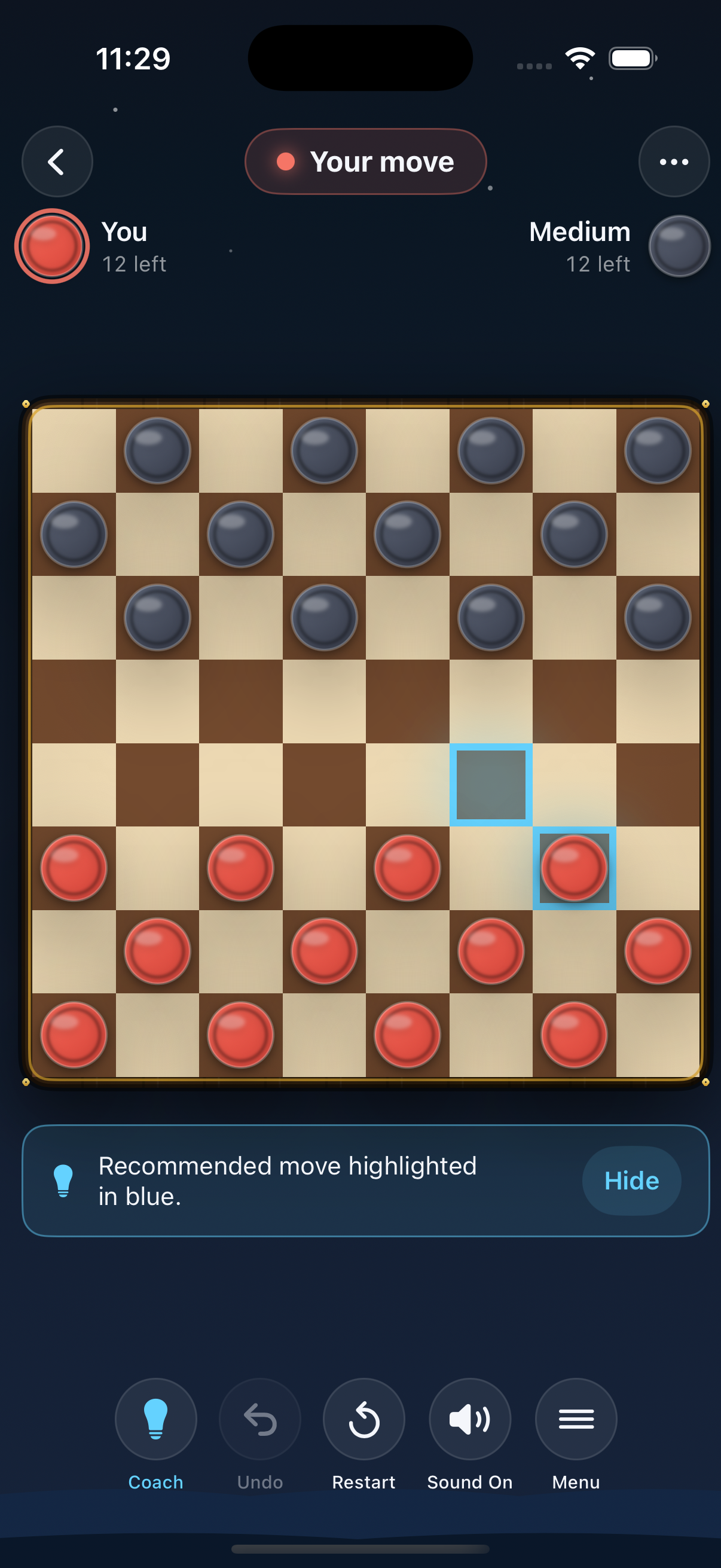 A digital checkers game in progress with red and black pieces on a checkerboard. The red pieces are at the bottom, and the black pieces are at the top. A recommended move is highlighted in blue. The interface shows player turn options, undo, restart, sound, and menu buttons.