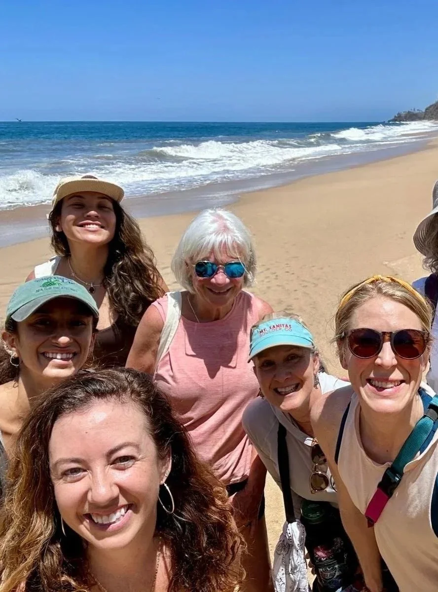 Guests enjoying a beach hike during a yoga and fitness retreat in Sayulita, Mexico.