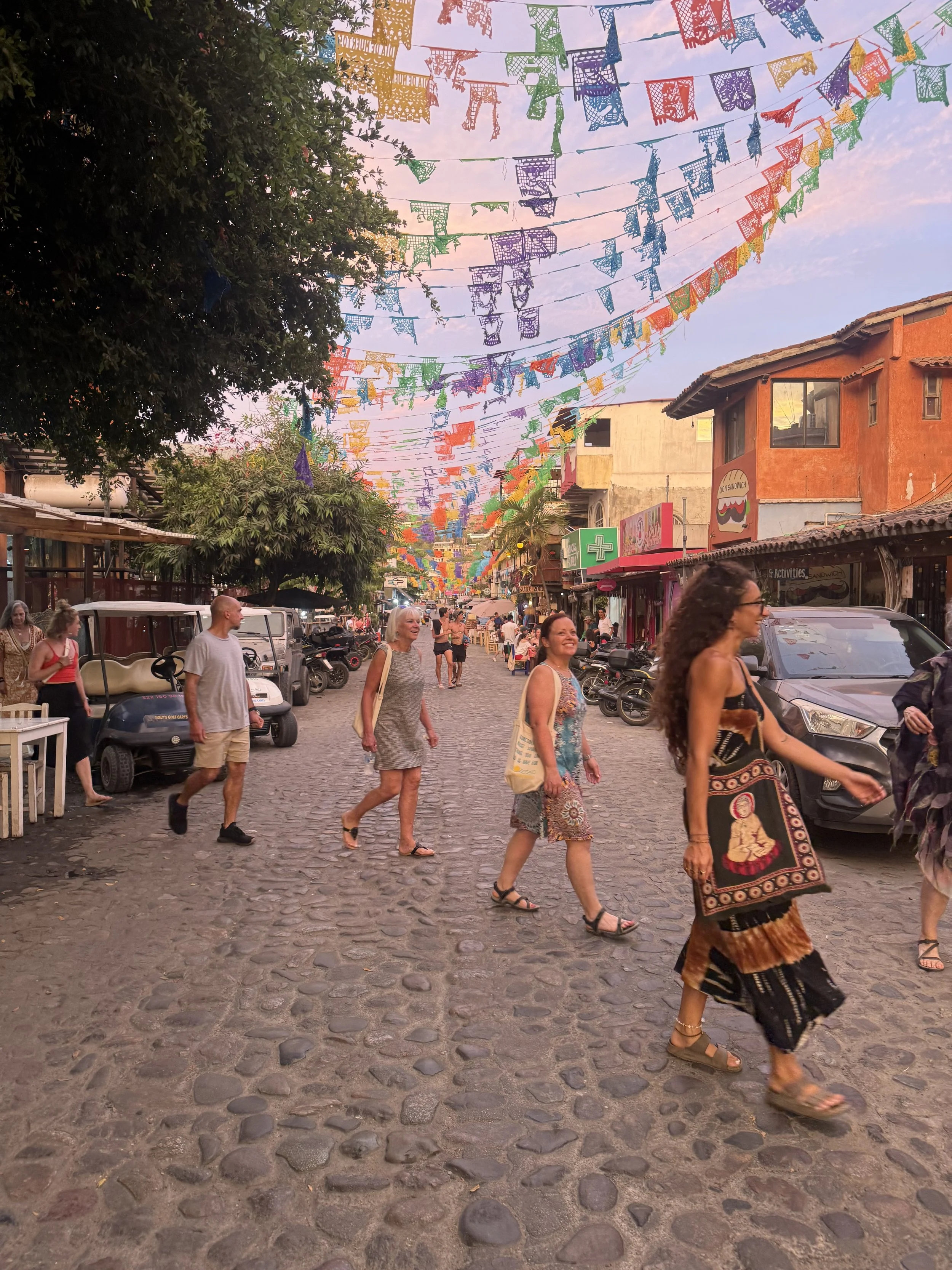 Guests exploring downtown Sayulita during a Sol Collective wellness retreat in Mexico
