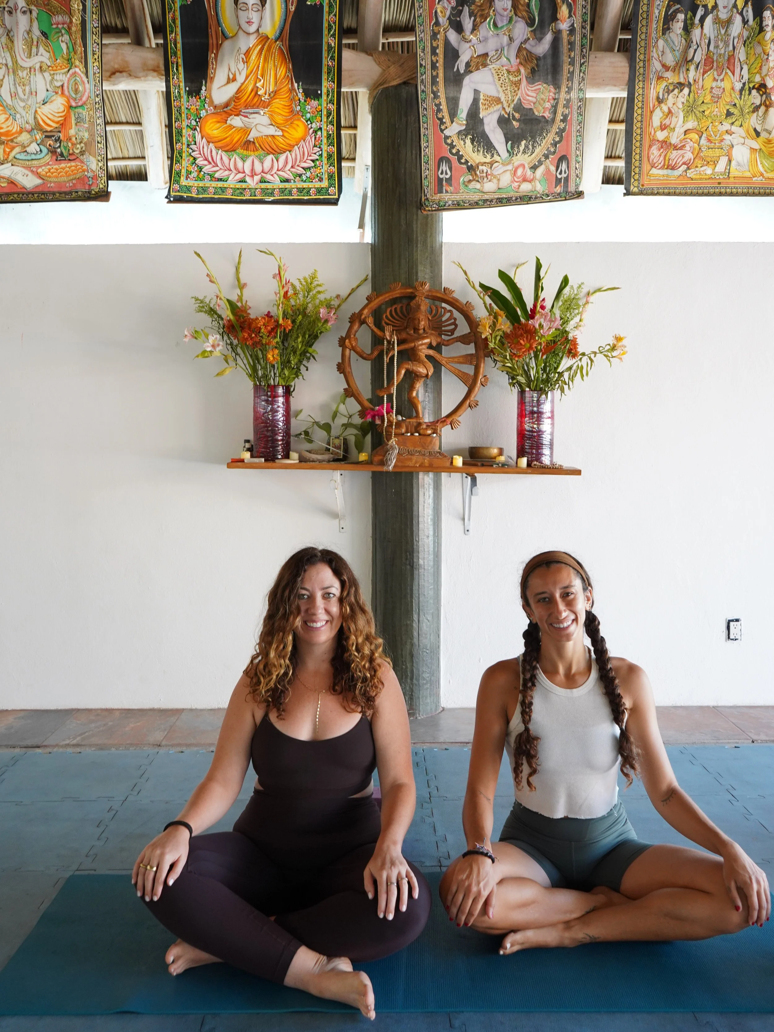 Sol Collective retreat facilitators seated for meditation practice in a jungle yoga shala in Sayulita, Mexico