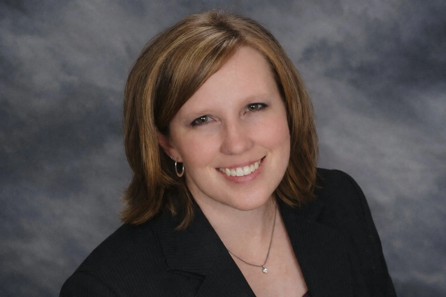 Portrait of Dawn Geoppinger, grief educator and somatic practitioner, offering gentle grief support and embodied healing.