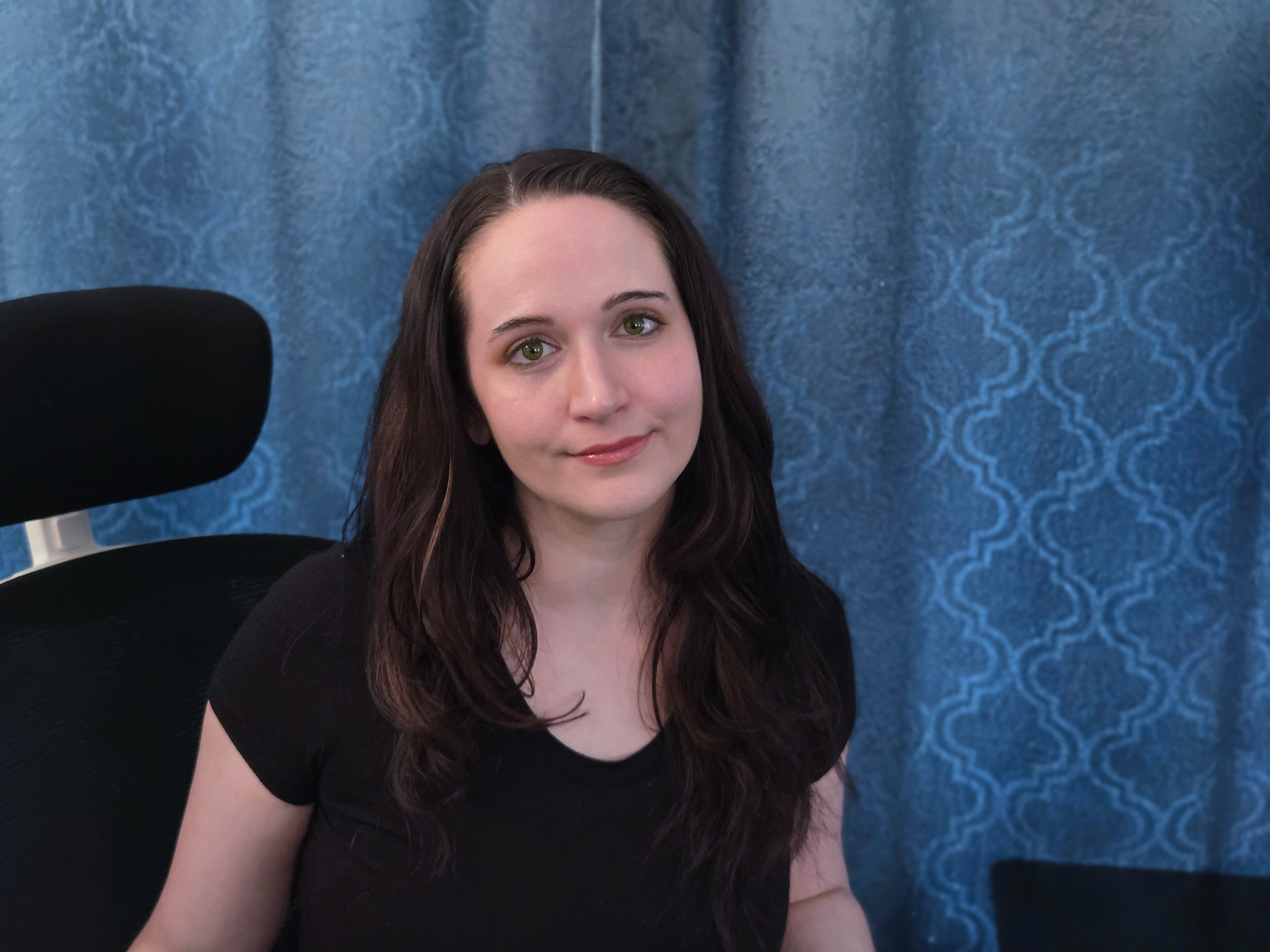 A woman smiling at the camera.