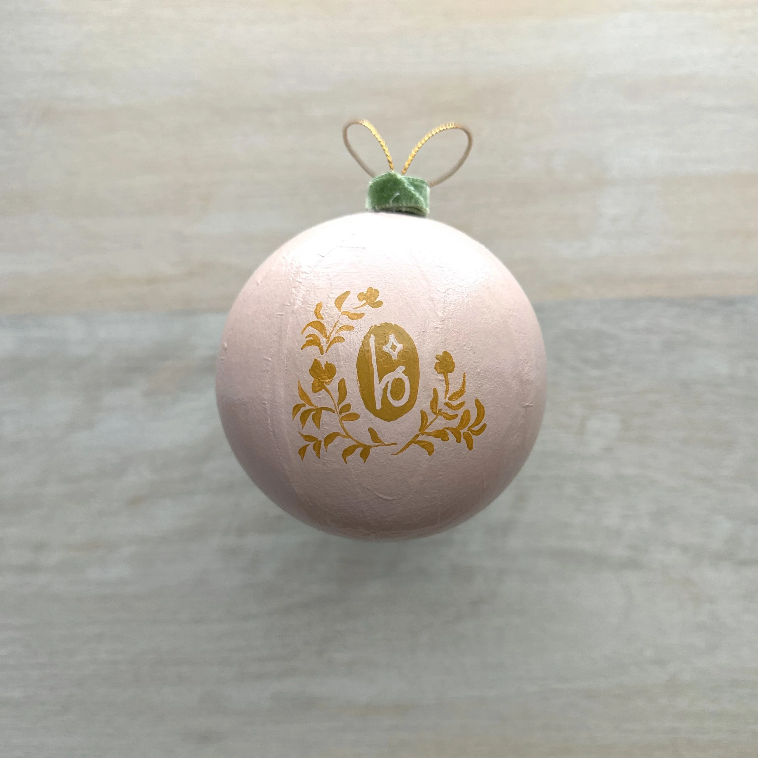 Pink and gold paper mache holiday ornament by Blair Frazier Art