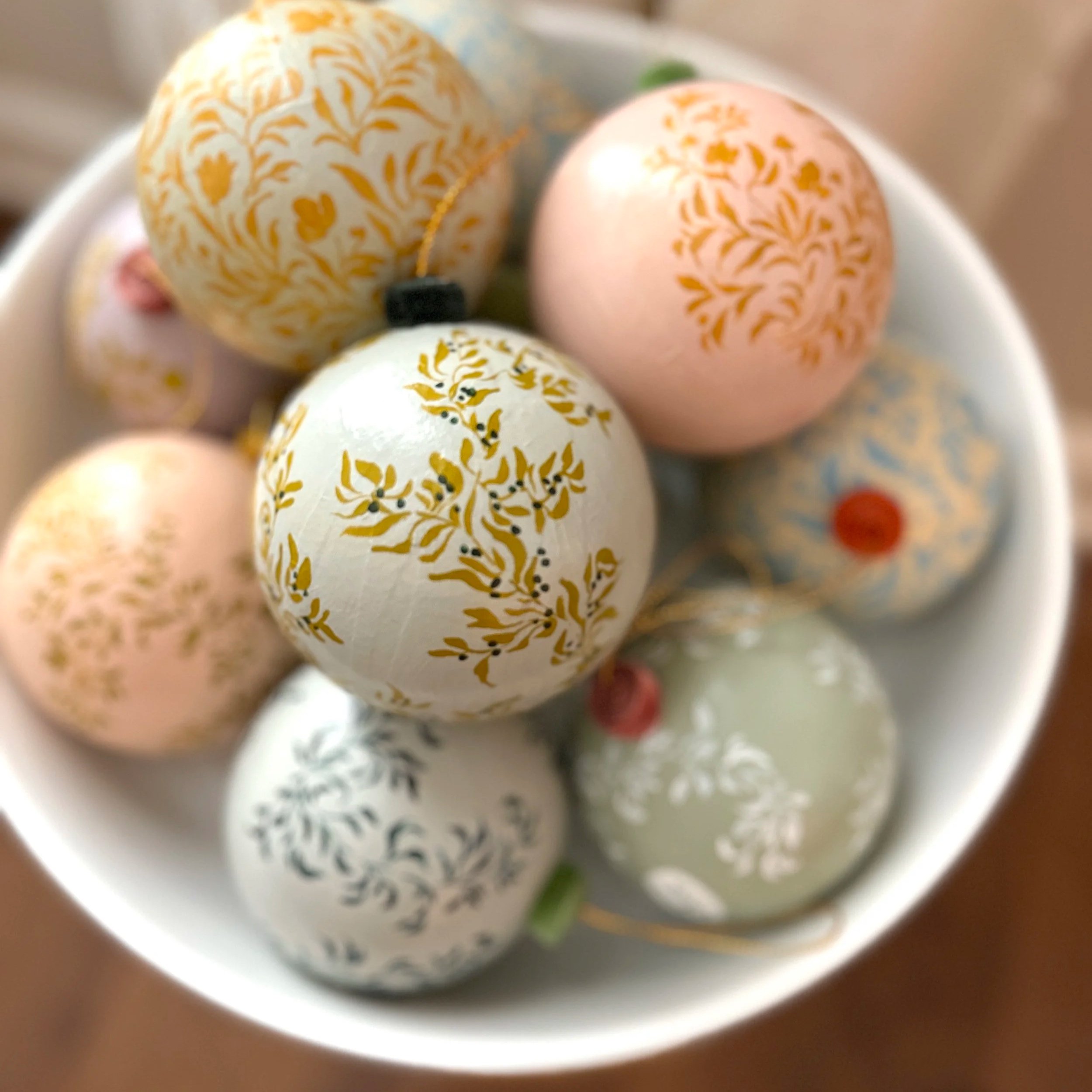 Bowl of hand painted Christmas ornaments by Blair Frazier Art