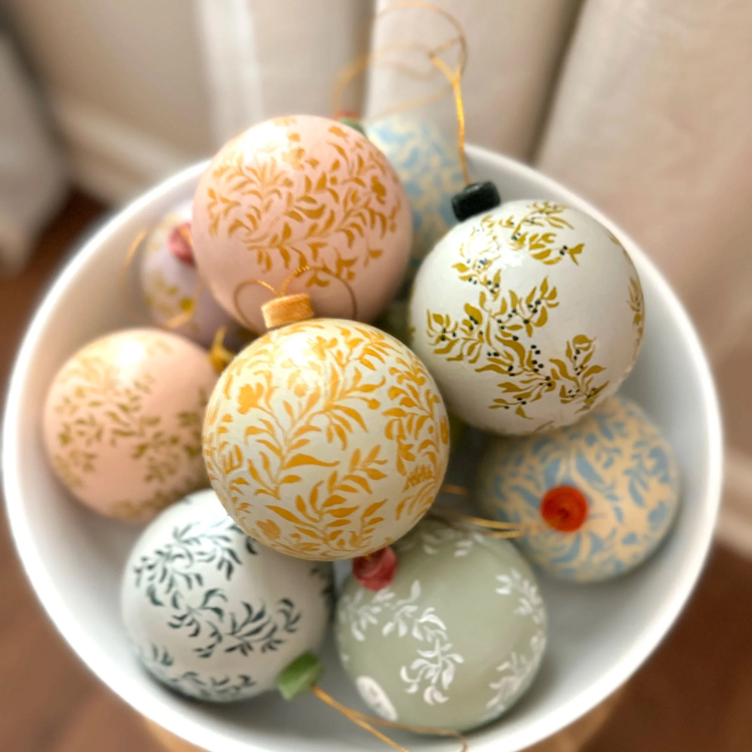 Bowl of hand painted Christmas ornaments by Blair Frazier Art
