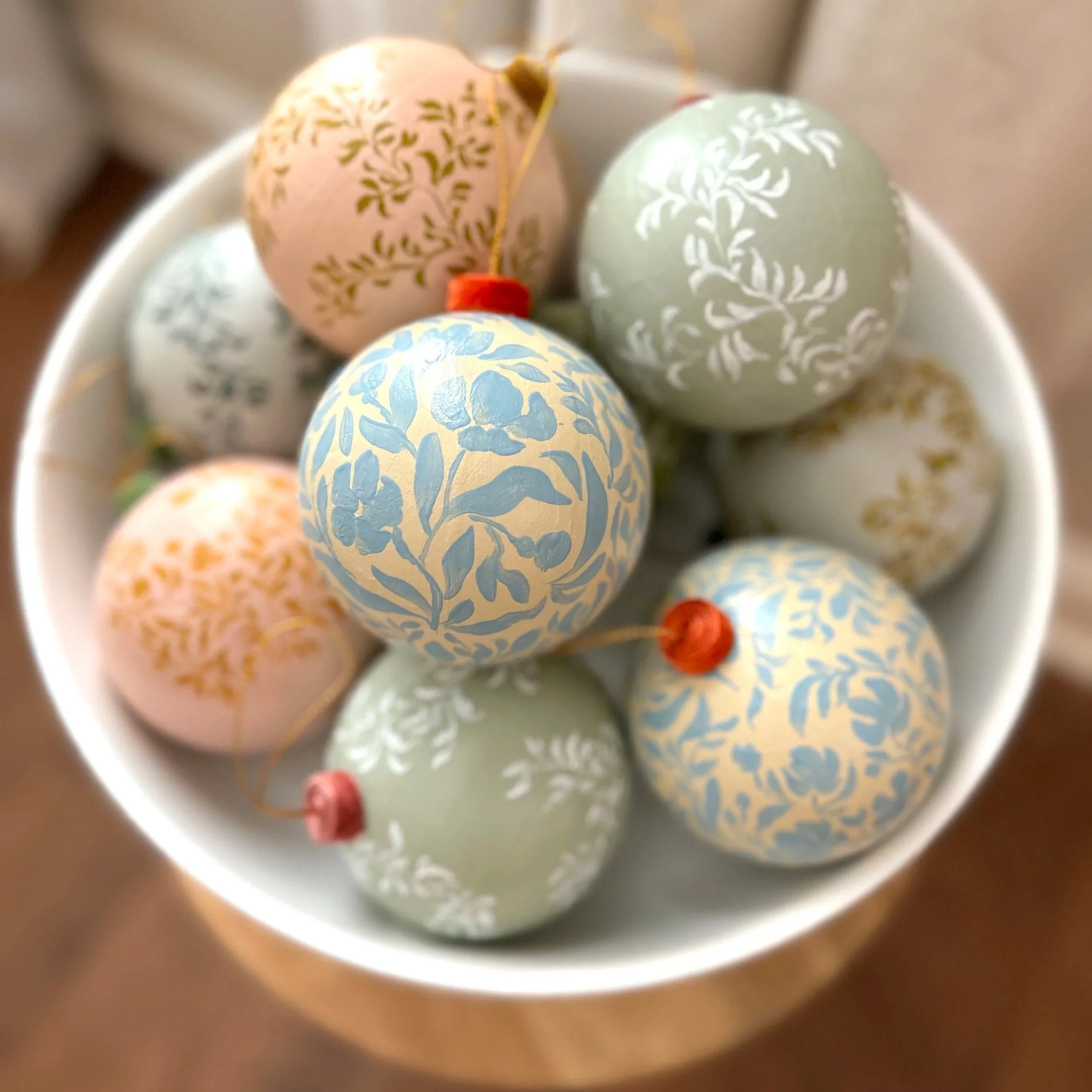 Bowl of hand painted Christmas ornaments by Blair Frazier Art