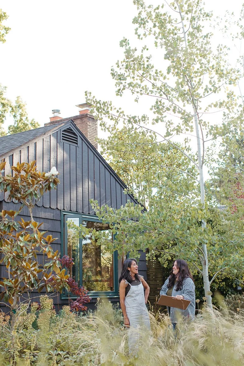 Image of the owner with a client in a landscape consulting