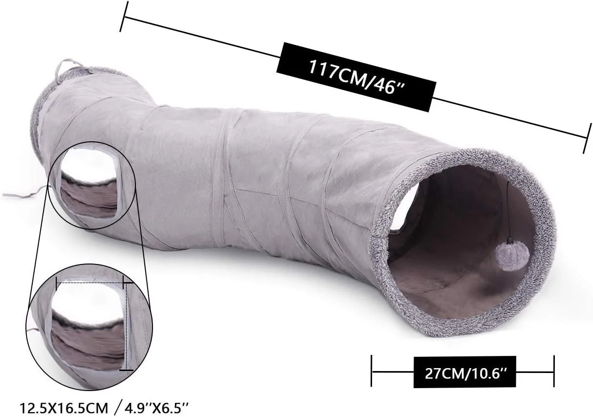 A long, cylindrical, soft grey cat tunnel with measurements showing it is 117 cm long and 27 cm in diameter. The tunnel has openings at both ends, with one featuring a dangling pom-pom toy. The material appears plush or fleece, and two close-up circles highlight the fabric's texture and the dimensions of a small opening inside.