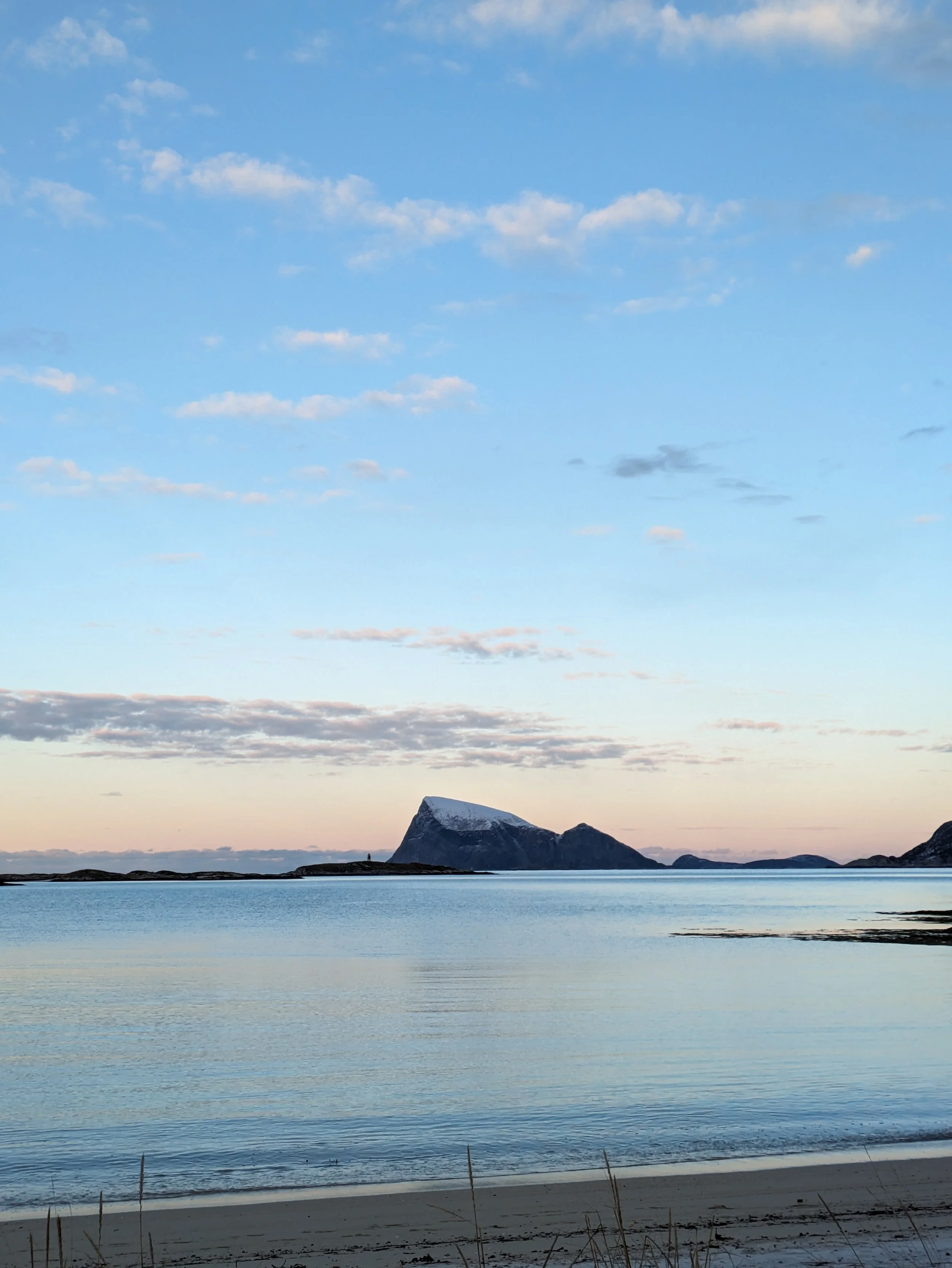 A beautiful beach in Tromsø, Norway. The serene beauty of the Arctic in winter.