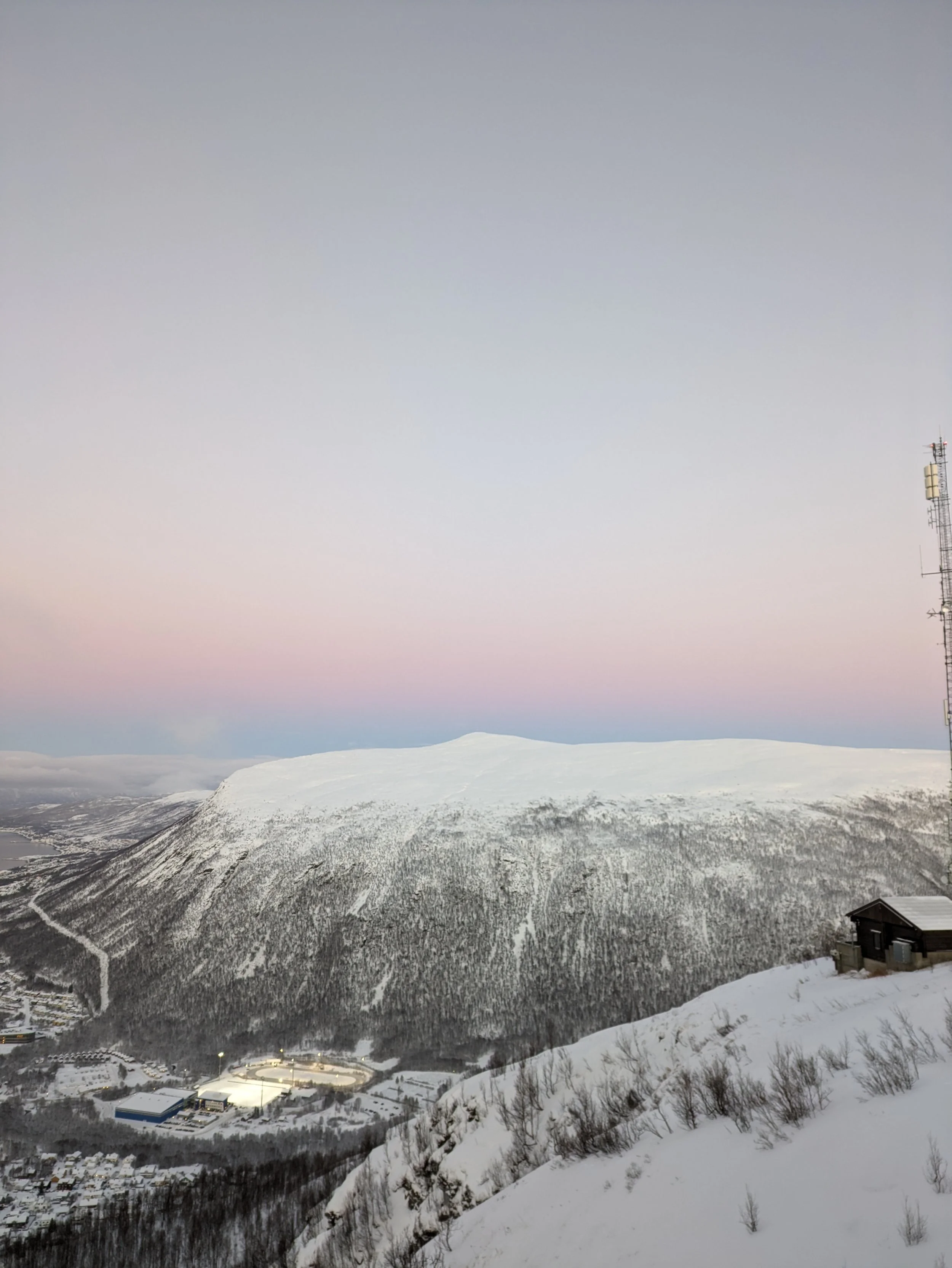         A perfect moment of reflection. The sun setting over the fjord in Tromsø, Norway, is a stunning reminder of the beauty of the Arctic.